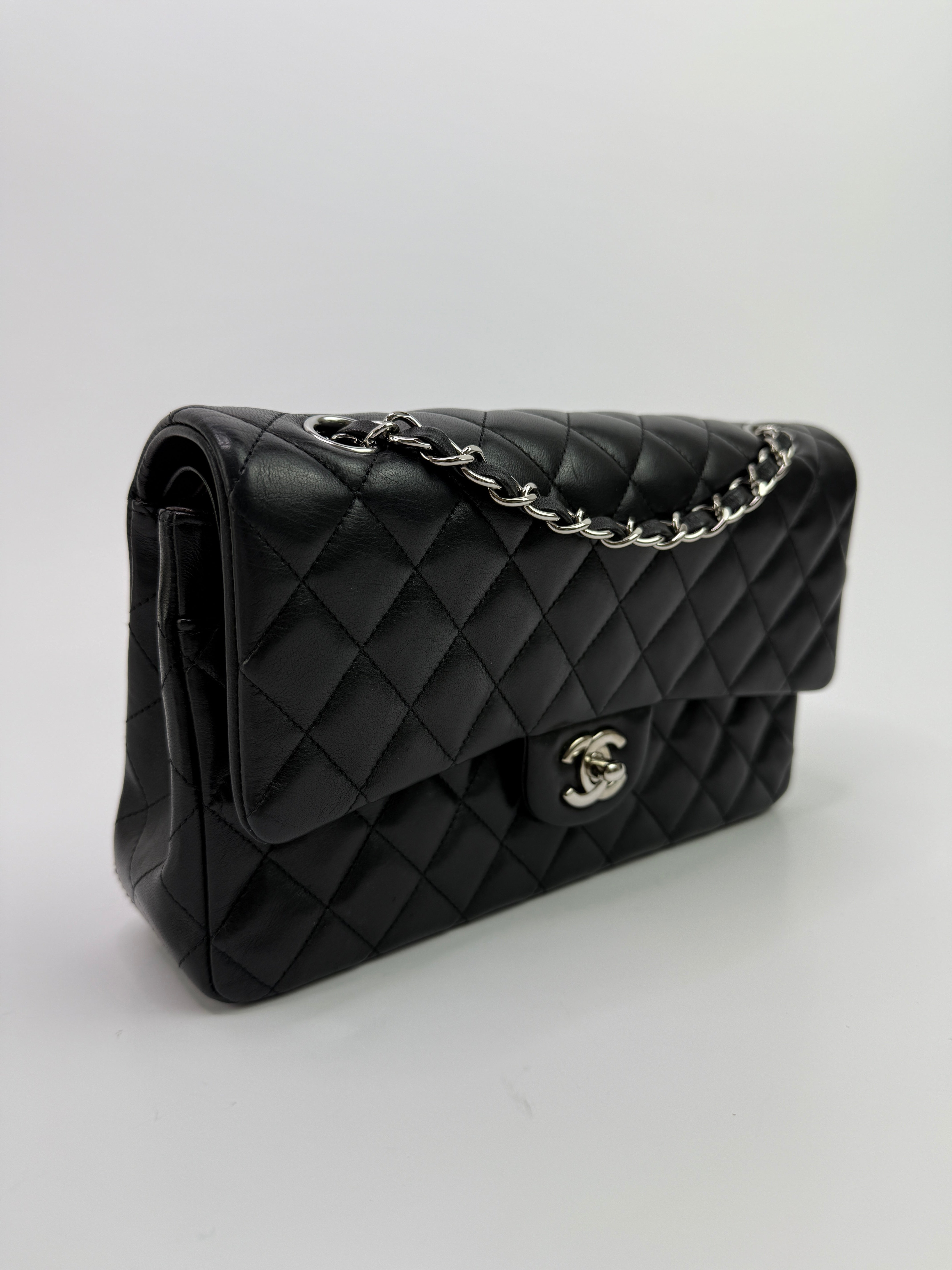 Authentic and preloved Chanel Medium Classic Double Flap Black Lambskin With Silver hardware Excellent condition. 100% Authenticity guarantee 
