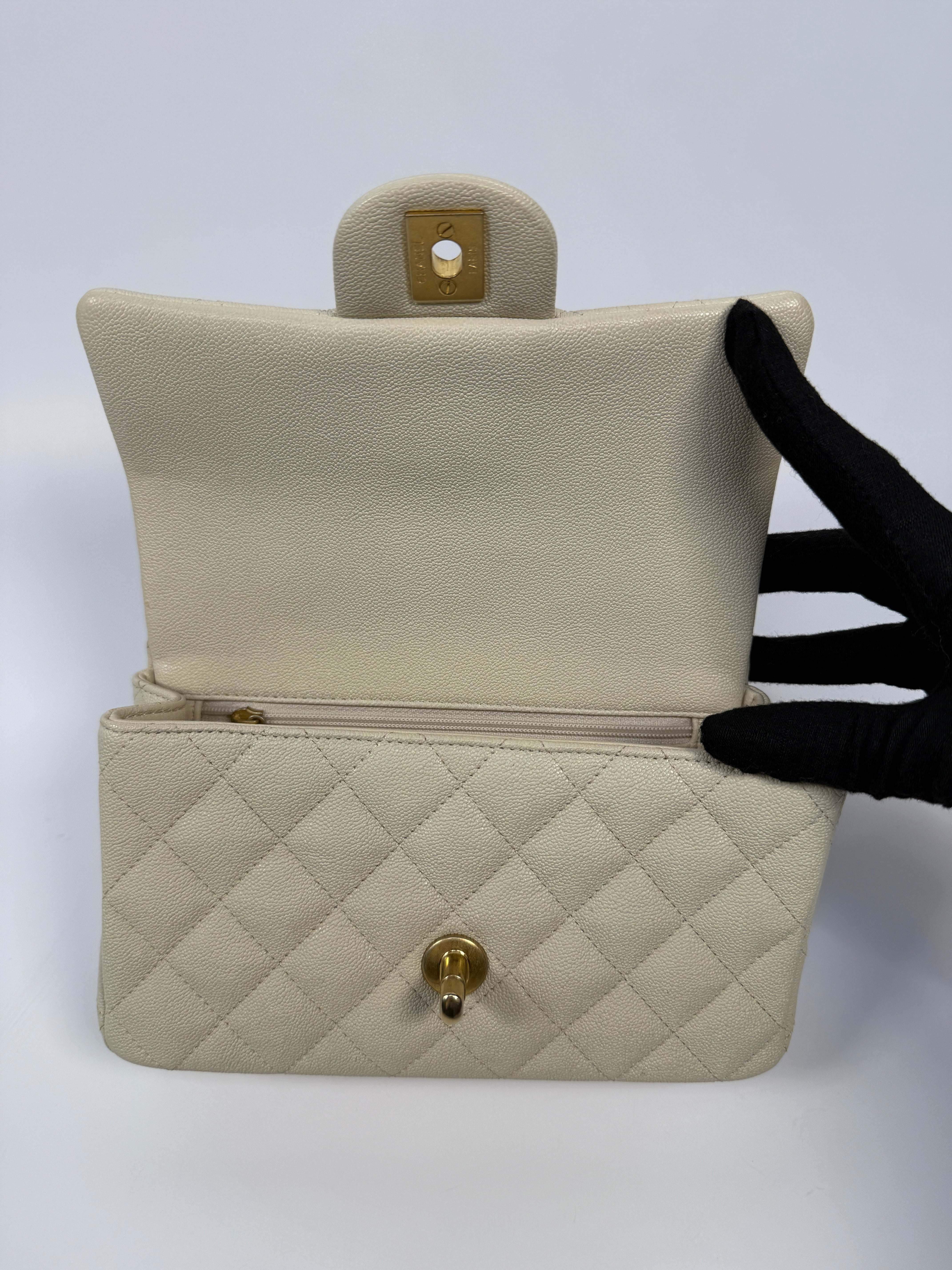 Chanel Mini Rectangle Top Handle In Ecru Caviar With Gold hardware, authentic and preloved in excellent condition