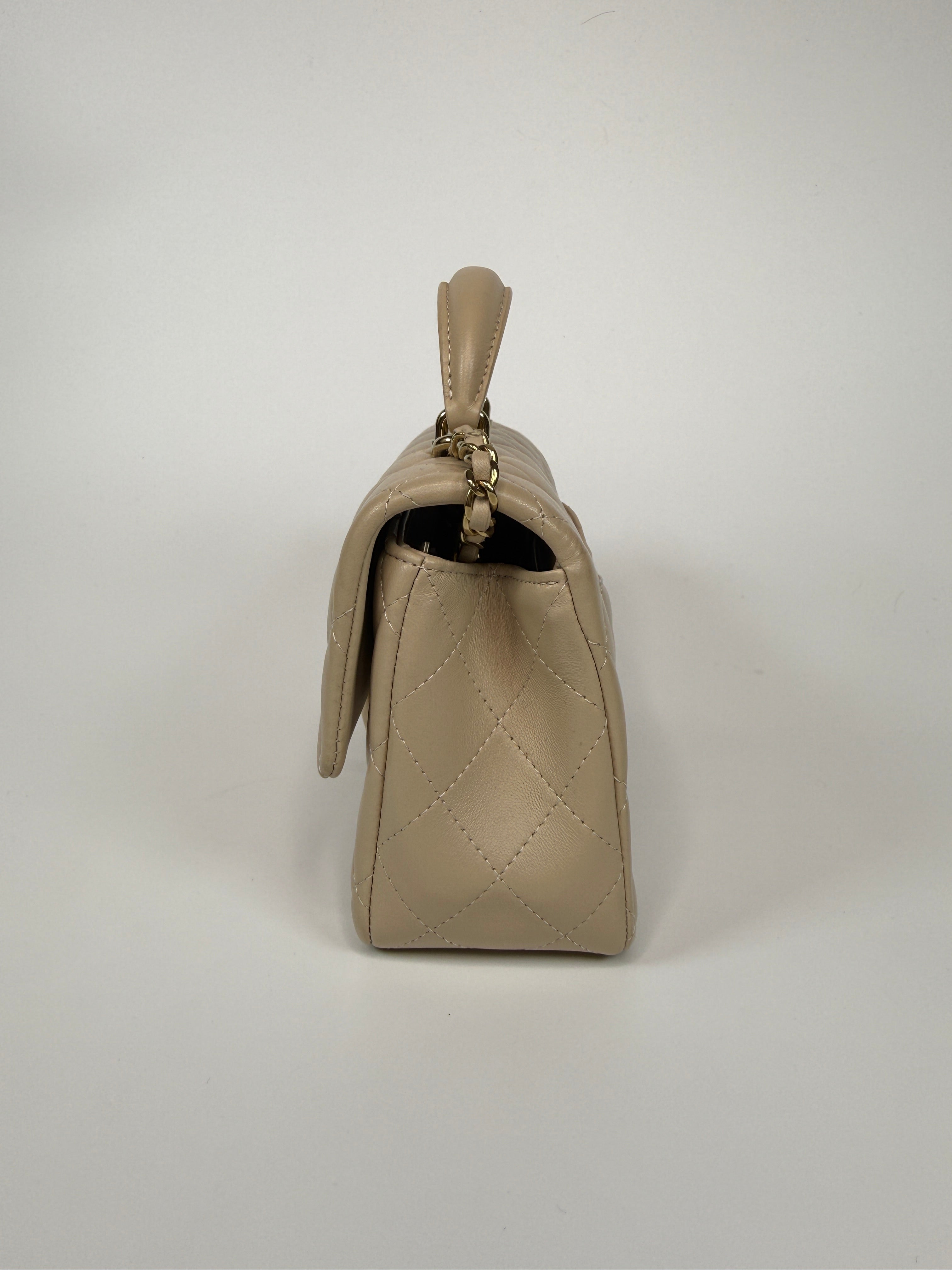 Authentic and preloved Chanel Mini Rectangle Top Handle In Ecru Lambskin With Gold Hardware in excellent condition, Fully insured next day delivery. Verified by Luxe Cheshire. 100% Authenticity guarantee,
