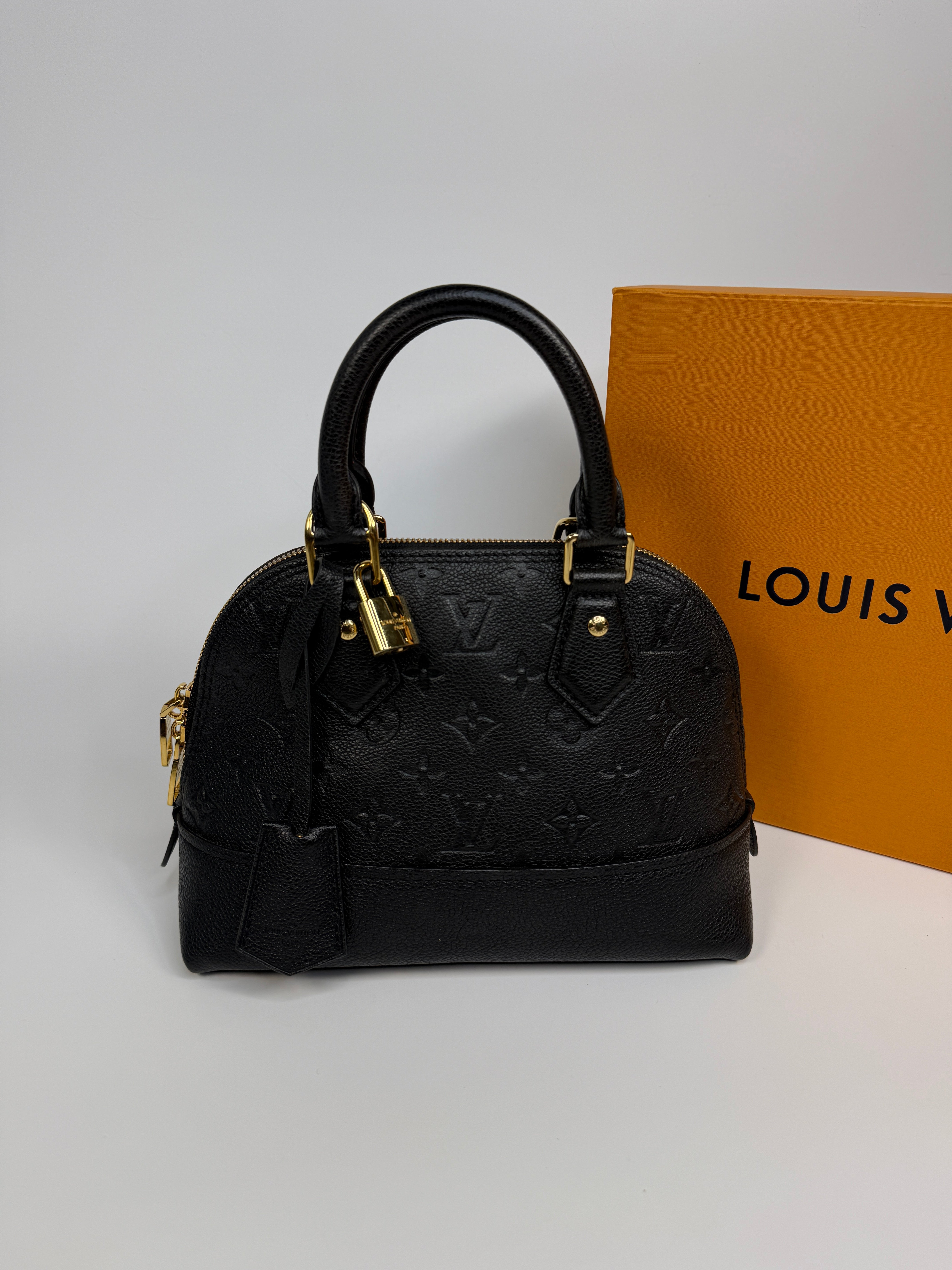 Authentic and preloved Louis Vuitton Alma BB In Empreinte Black Monogram With Gold Hardware