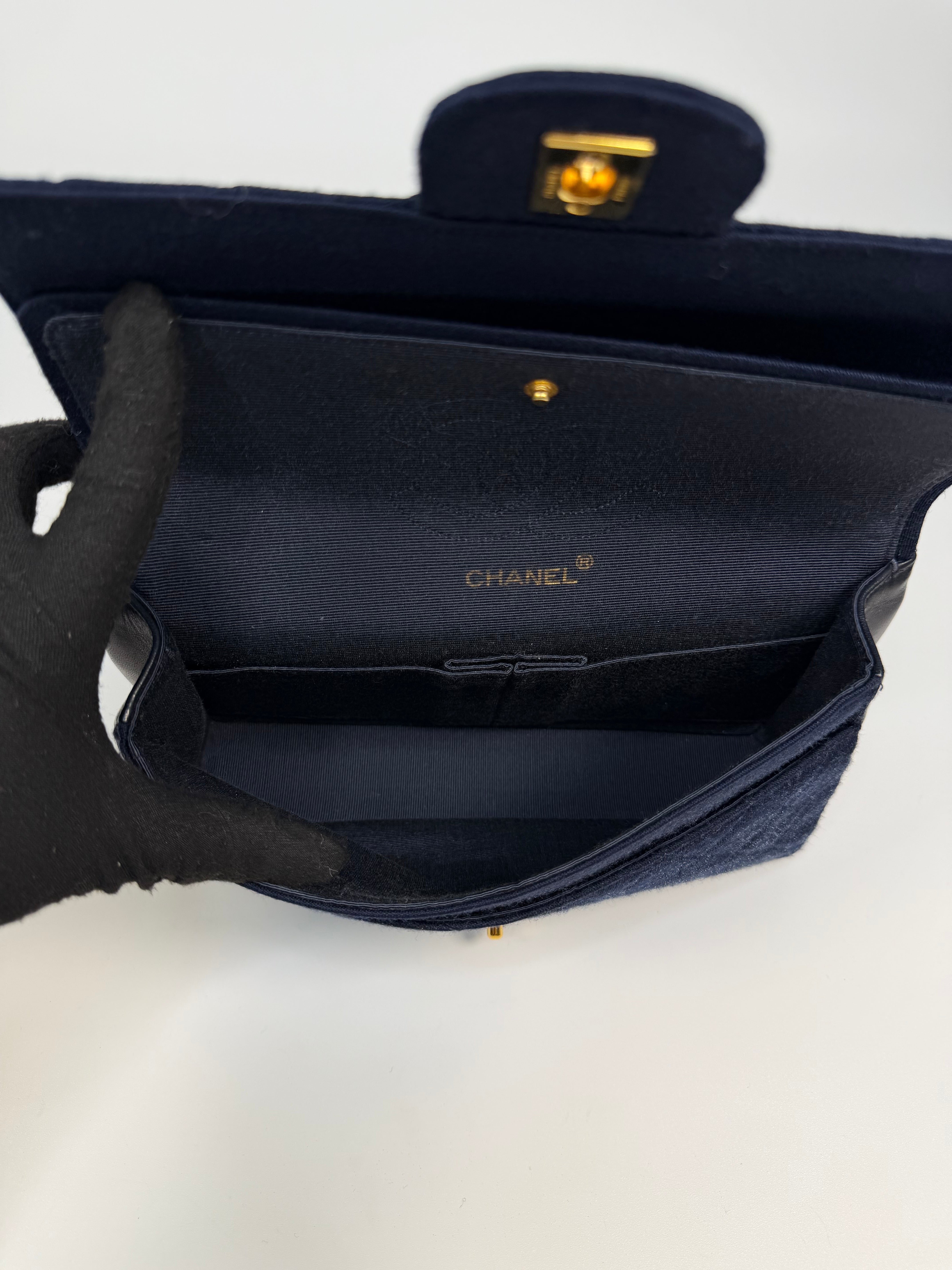 Chanel Vintage Medium Double Flap Navy Cotton With 24Kt Gold Hardware. Authentic and preloved in excellent condition.