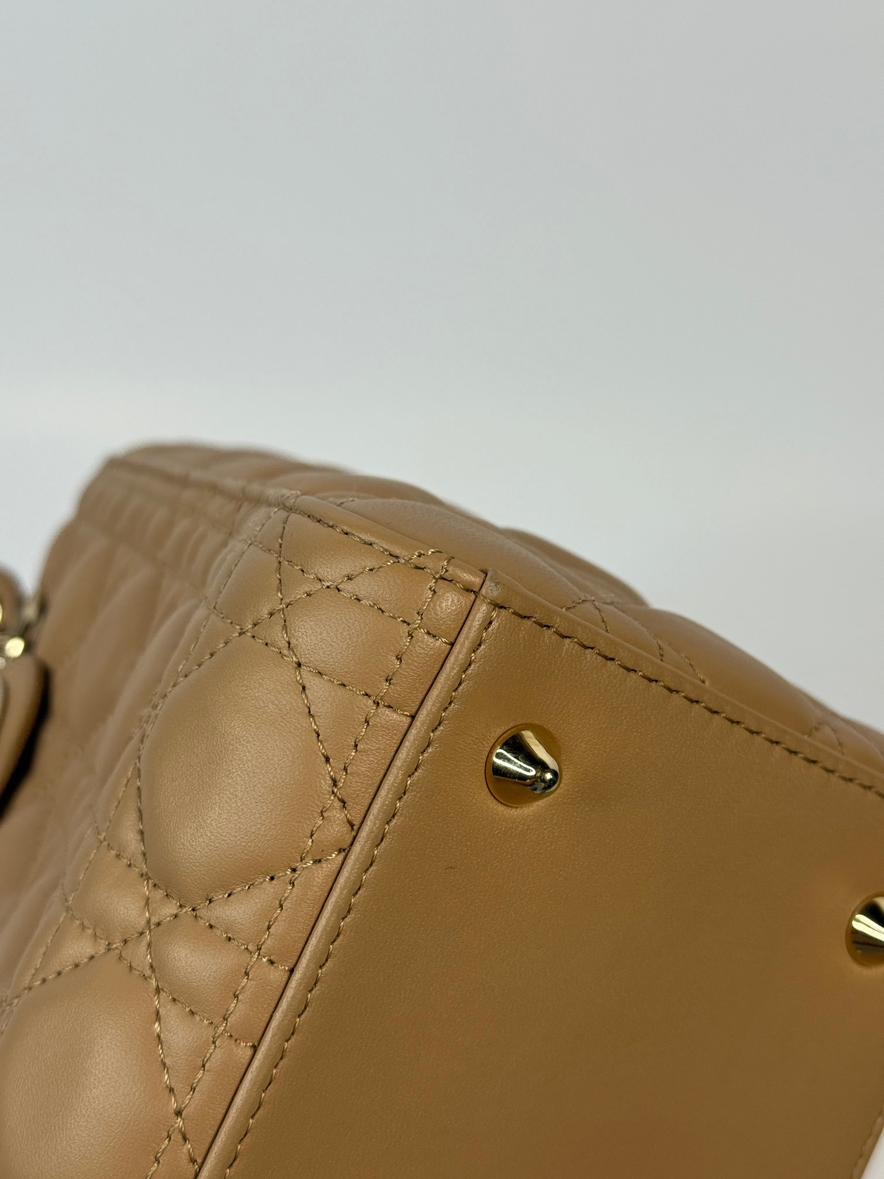 Authentic pre-loved Christian Dior Medium Lady Dior Bag in gold with gold hardware