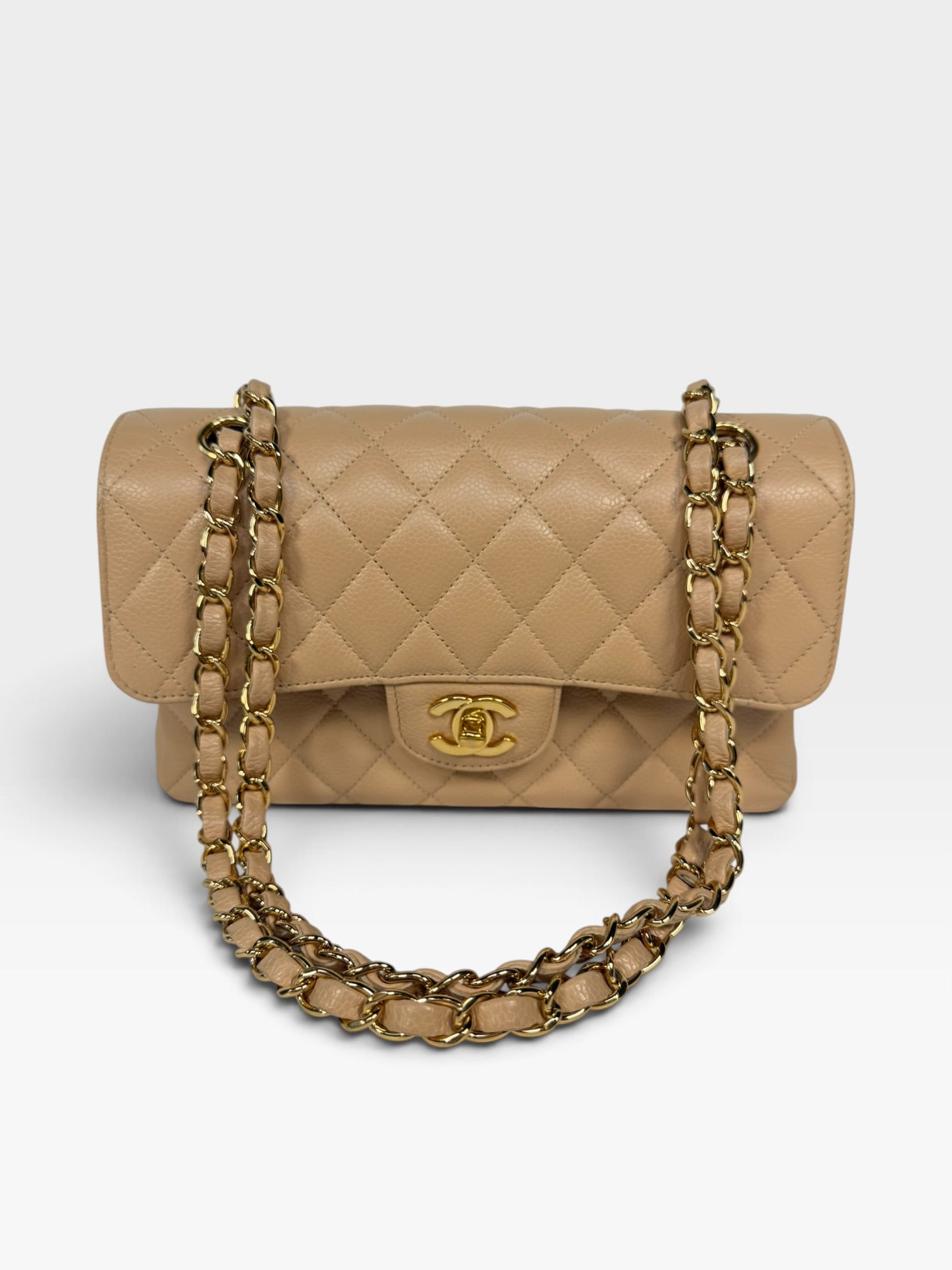 Chanel Small Classic Double Flap In Beige Caviar Leather With Gold Hardware. 100% authentic and preloved in excellent condition.