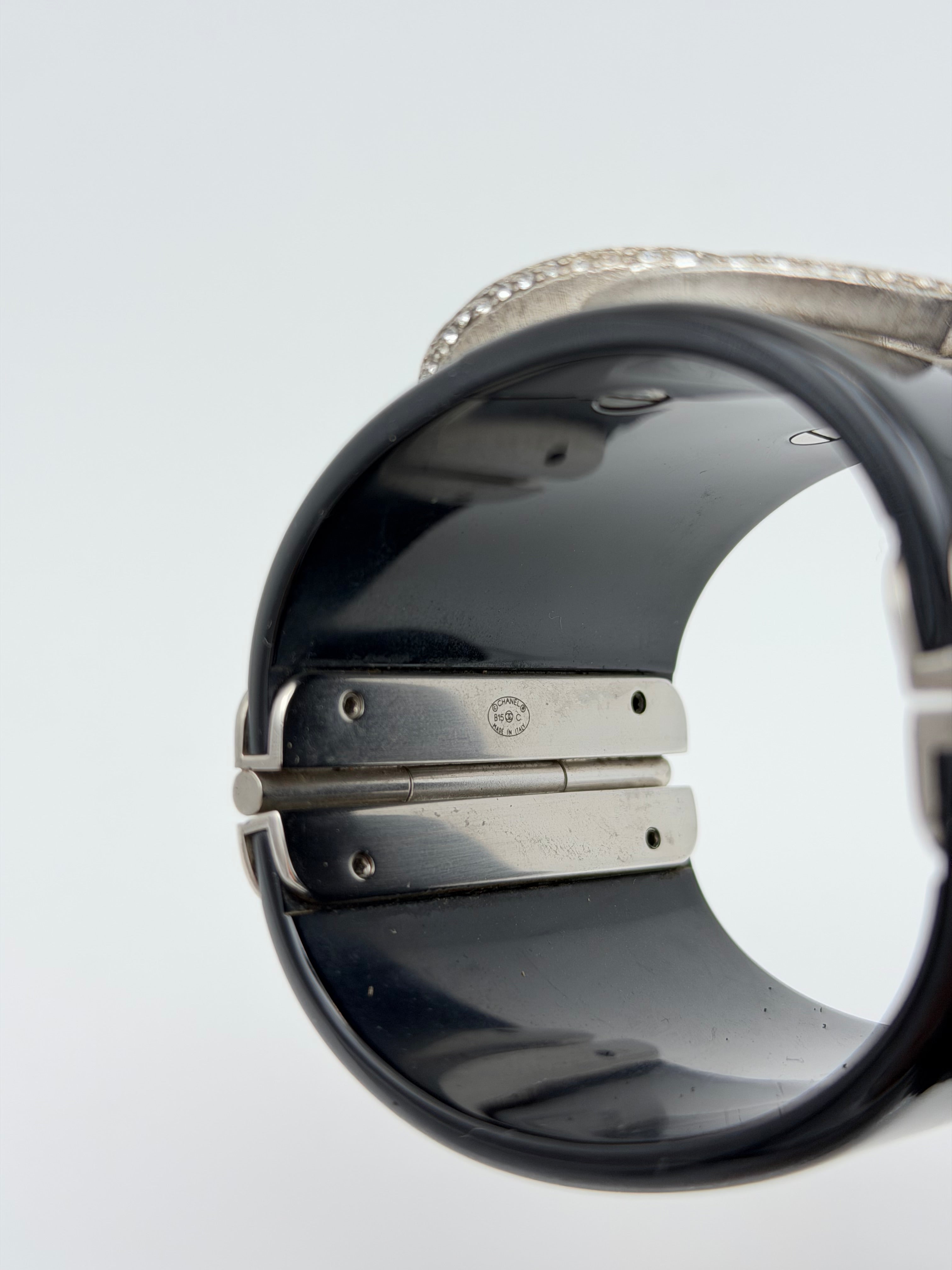 Chanel cc Black resin and rhinestone cuff in black enamel. Very Good condition. Authentic and preloved. 