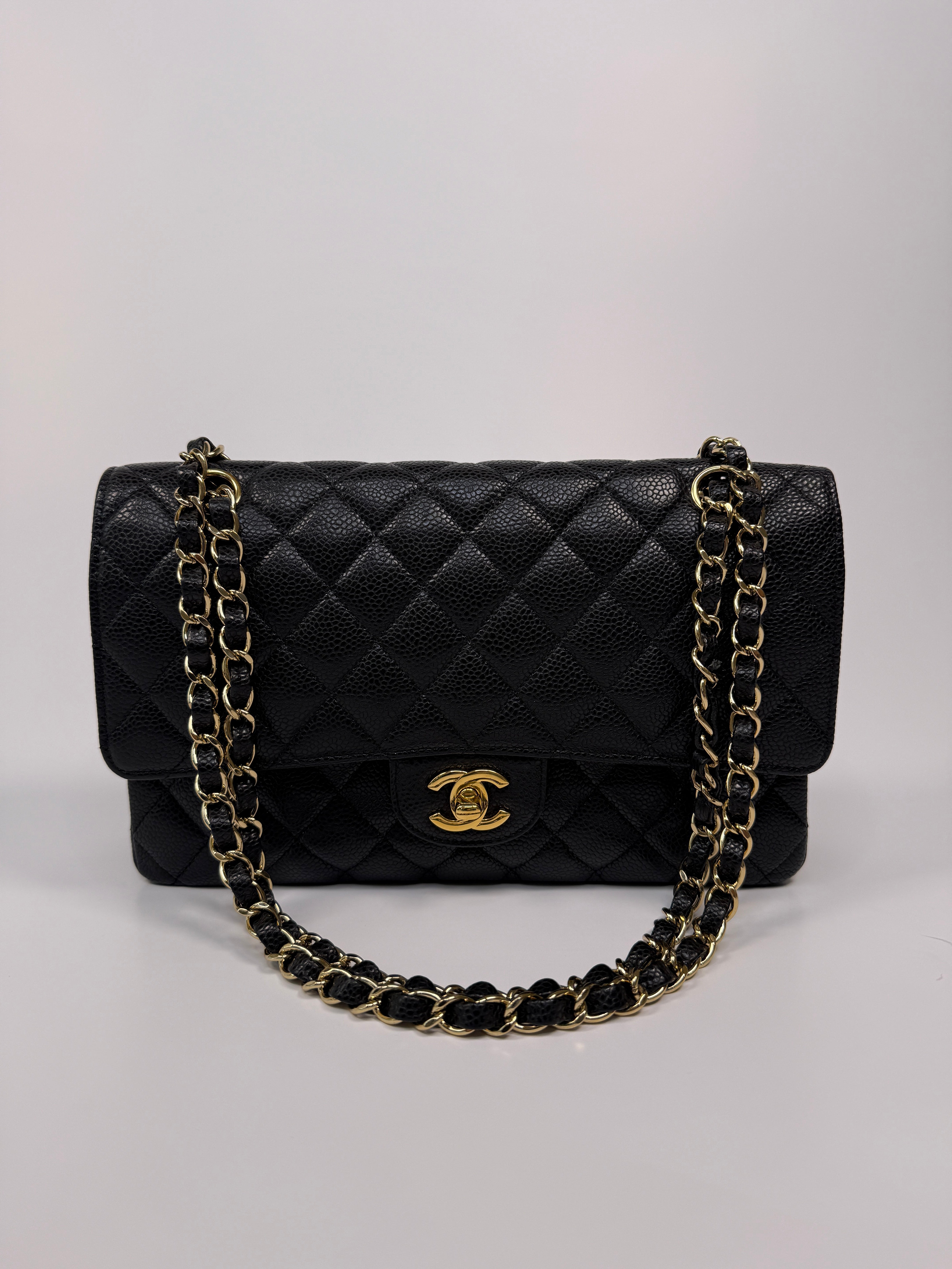 Chanel Medium Classic Double Flap Black CaviarWith Gold Hardware
Pre Loved & Authentic 