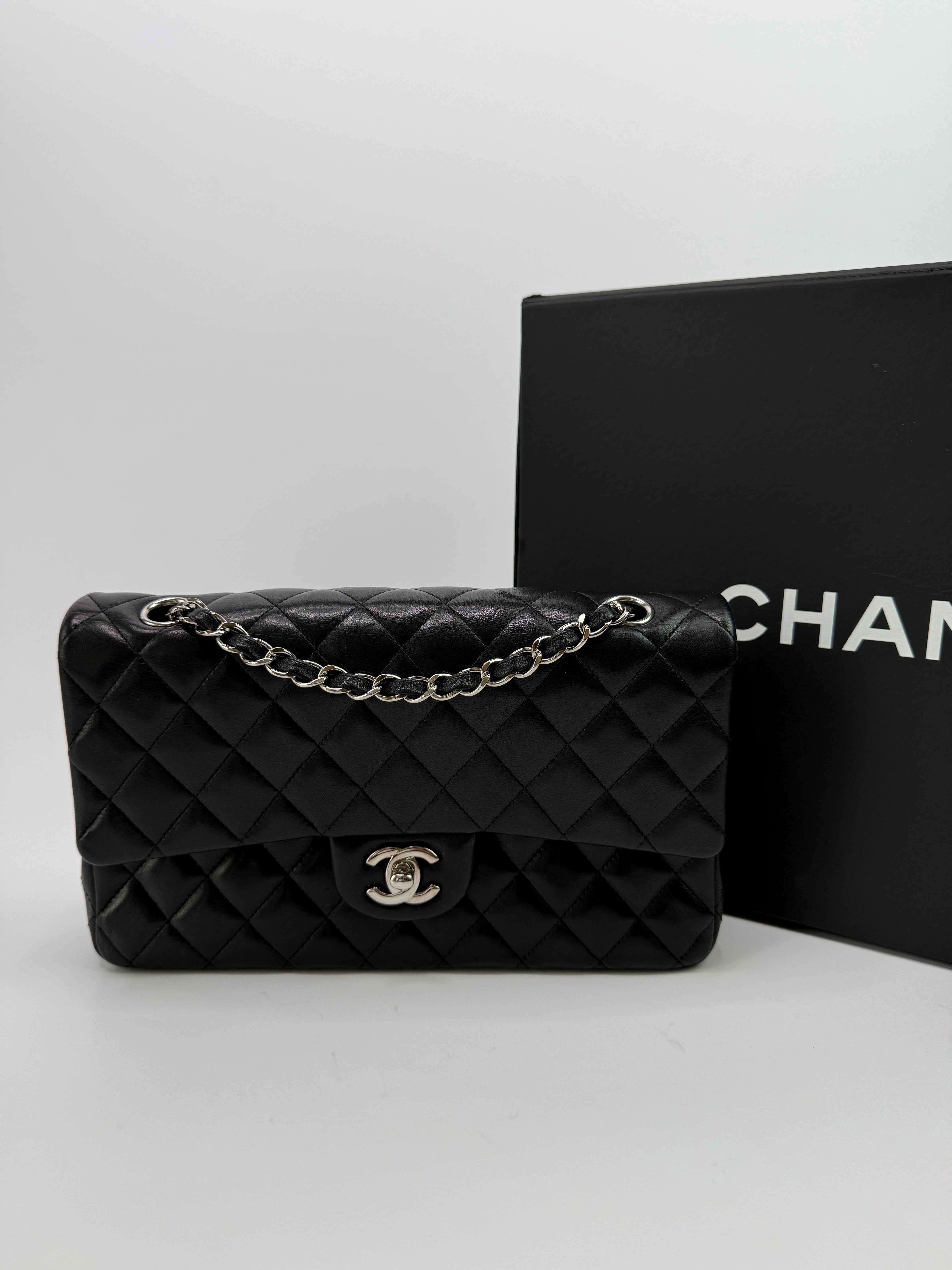 Authentic and preloved Chanel Medium Classic Double Flap Black Lambskin With Silver hardware Excellent condition. 100% Authenticity guarantee 
