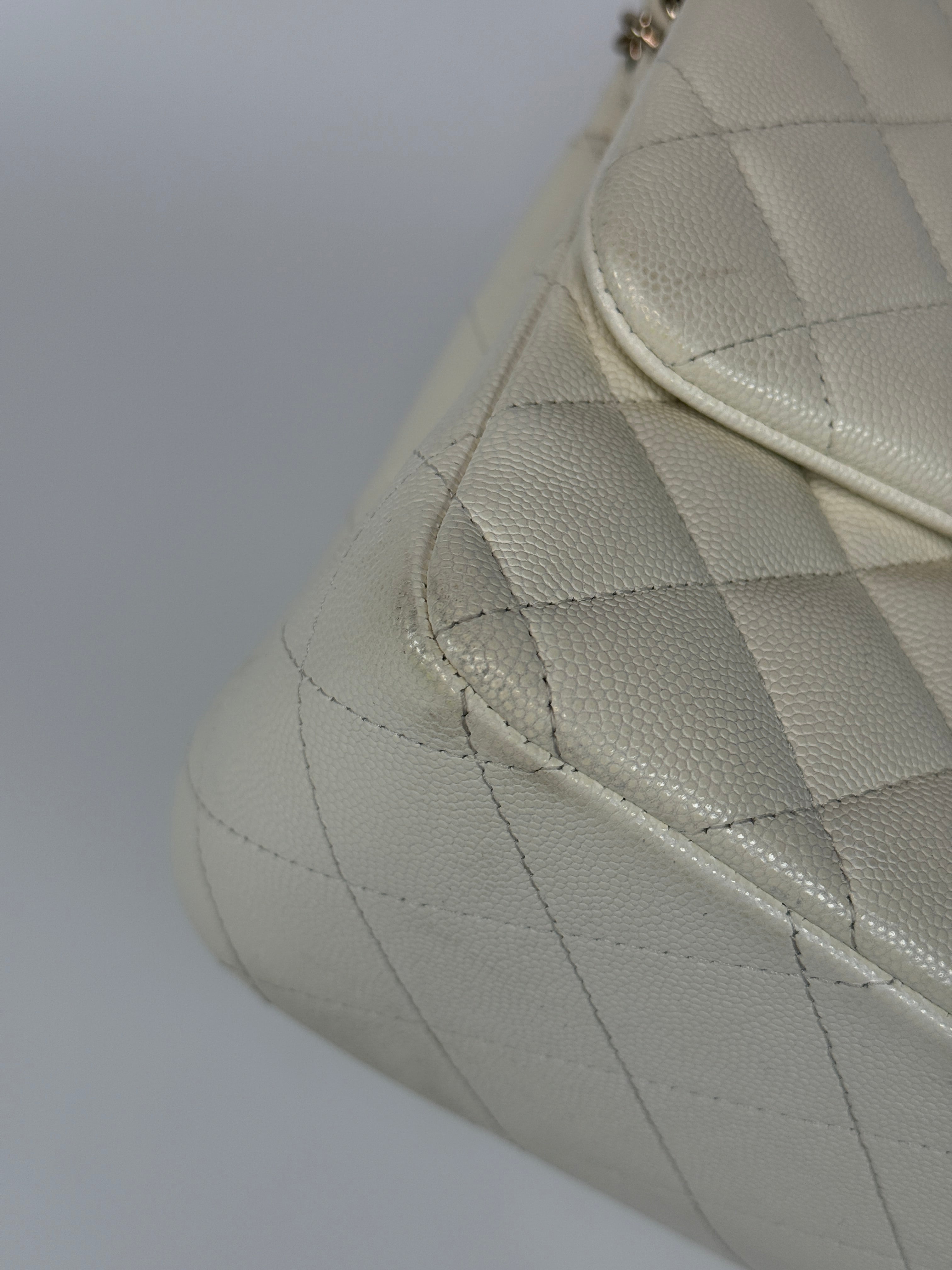 Authentic pre-loved Chanel Classic Jumbo Flap Bag In White Caviar Leather With pale gold  hardware in very good condition. Verified by Luxe Cheshire. International, fast  and fully insured delivery. Trusted designer resale.