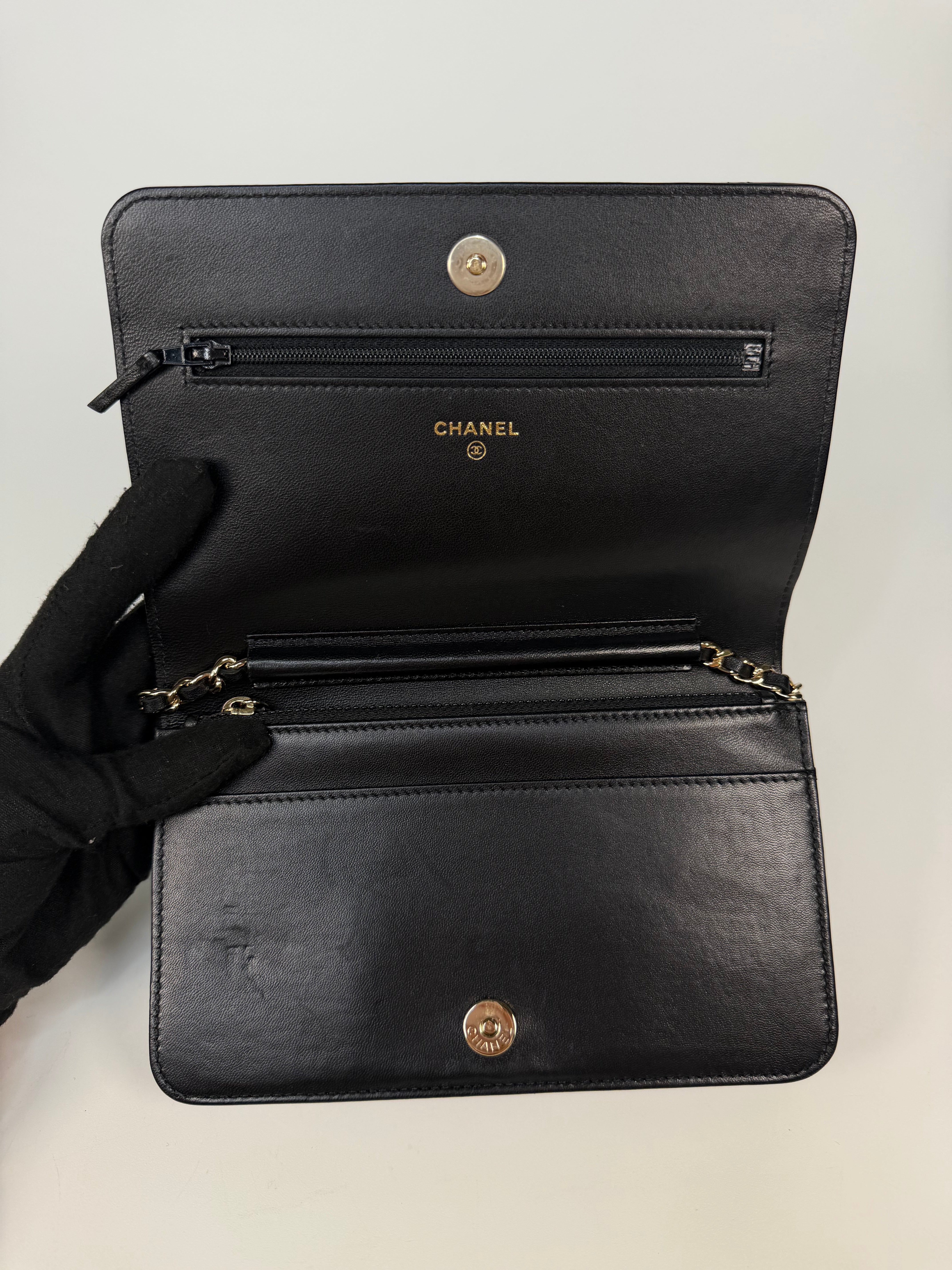 Chanel  Wallet On Chain Black lambskin Leather Gold hardware
Very Good condition, Authentic, Pre Loved. Verified by Luxe Cheshire. International, fast and fully insured delivery. Trusted designer resale.