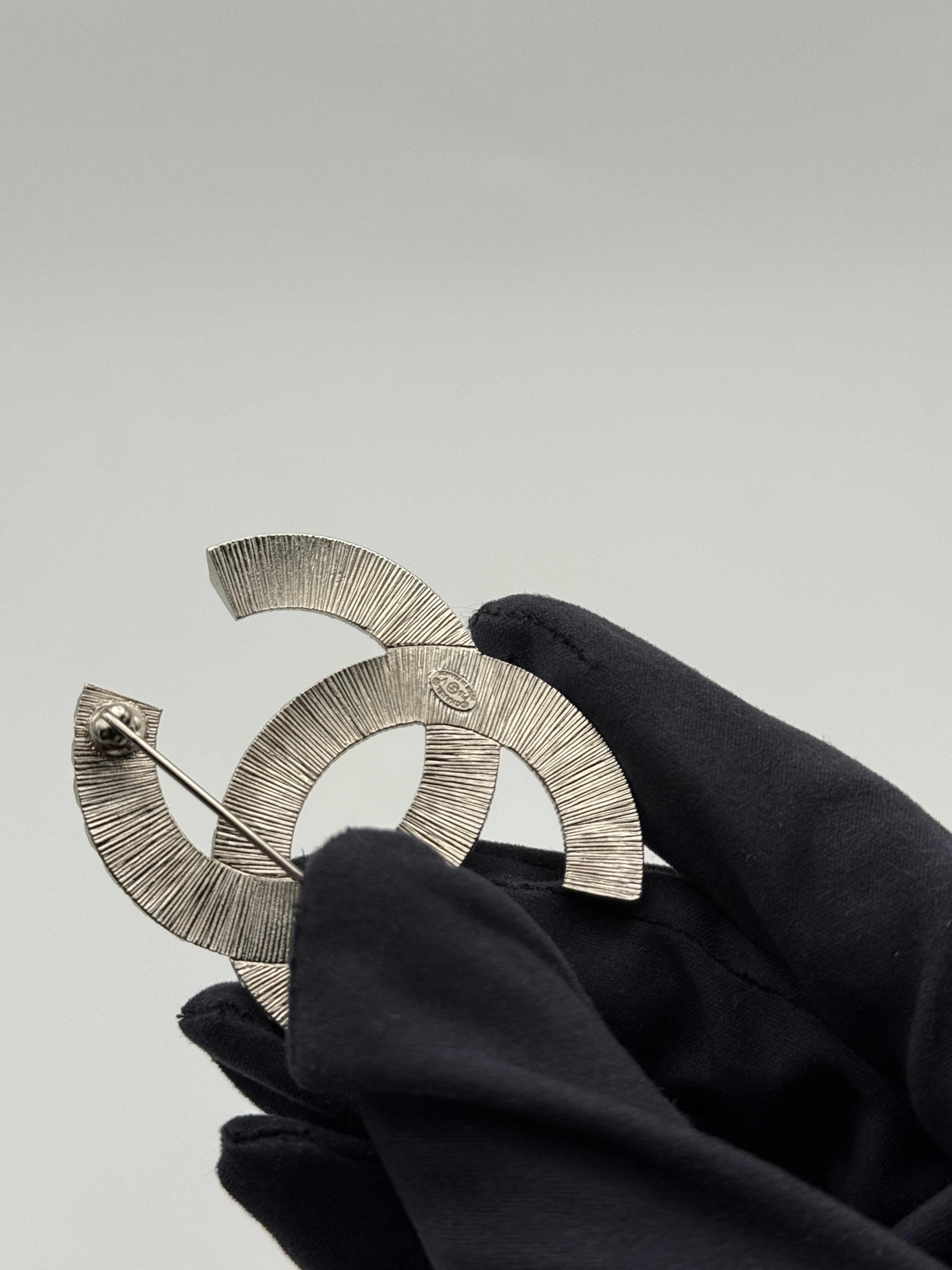 Chanel CC Rhinestone Brooch Silver. Authentic and preloved in excellent condition 