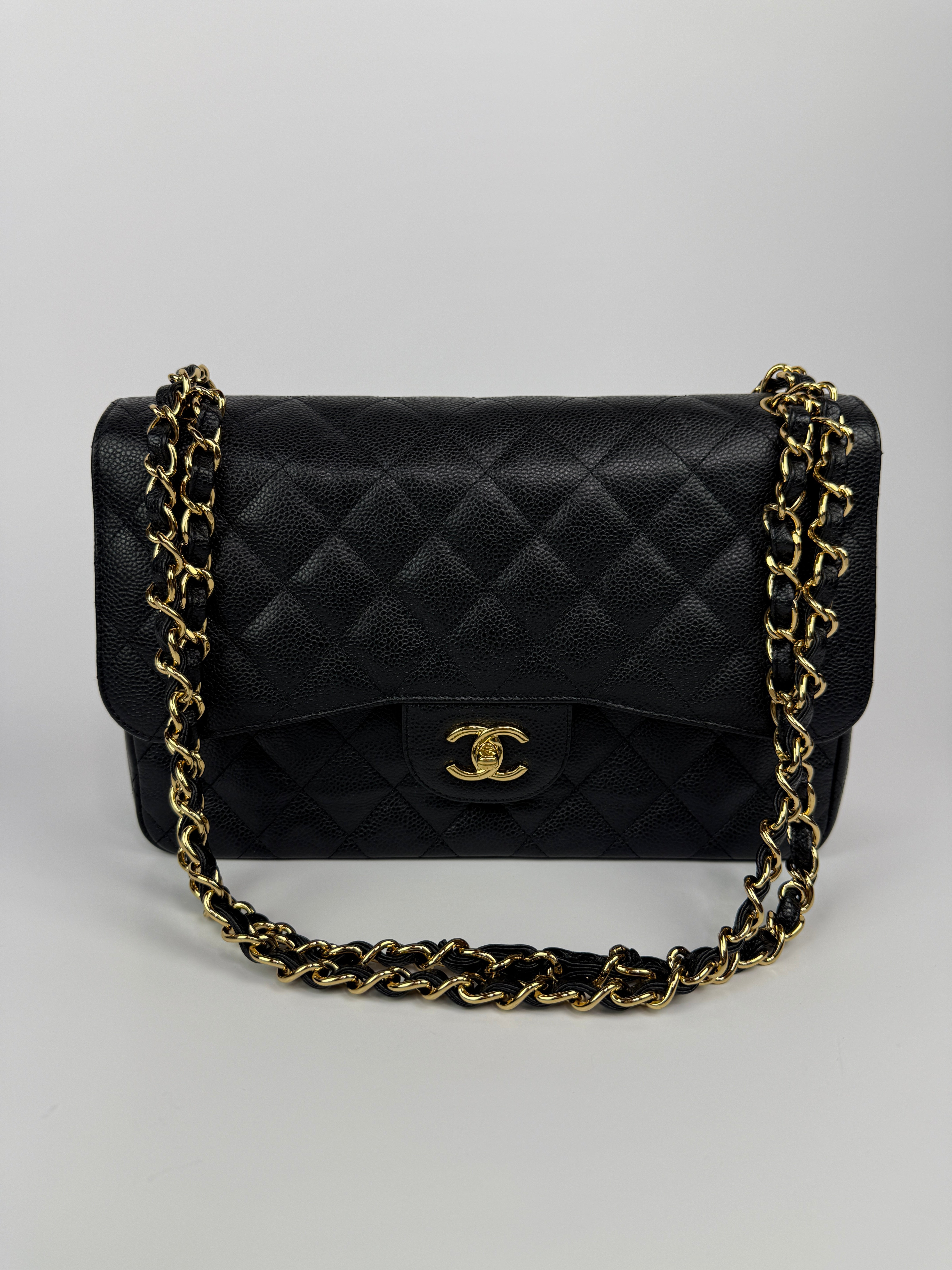 Chanel Jumbo Classic Double Flap In Black Caviar Gold Hardware
Pre Loved & Authentic 