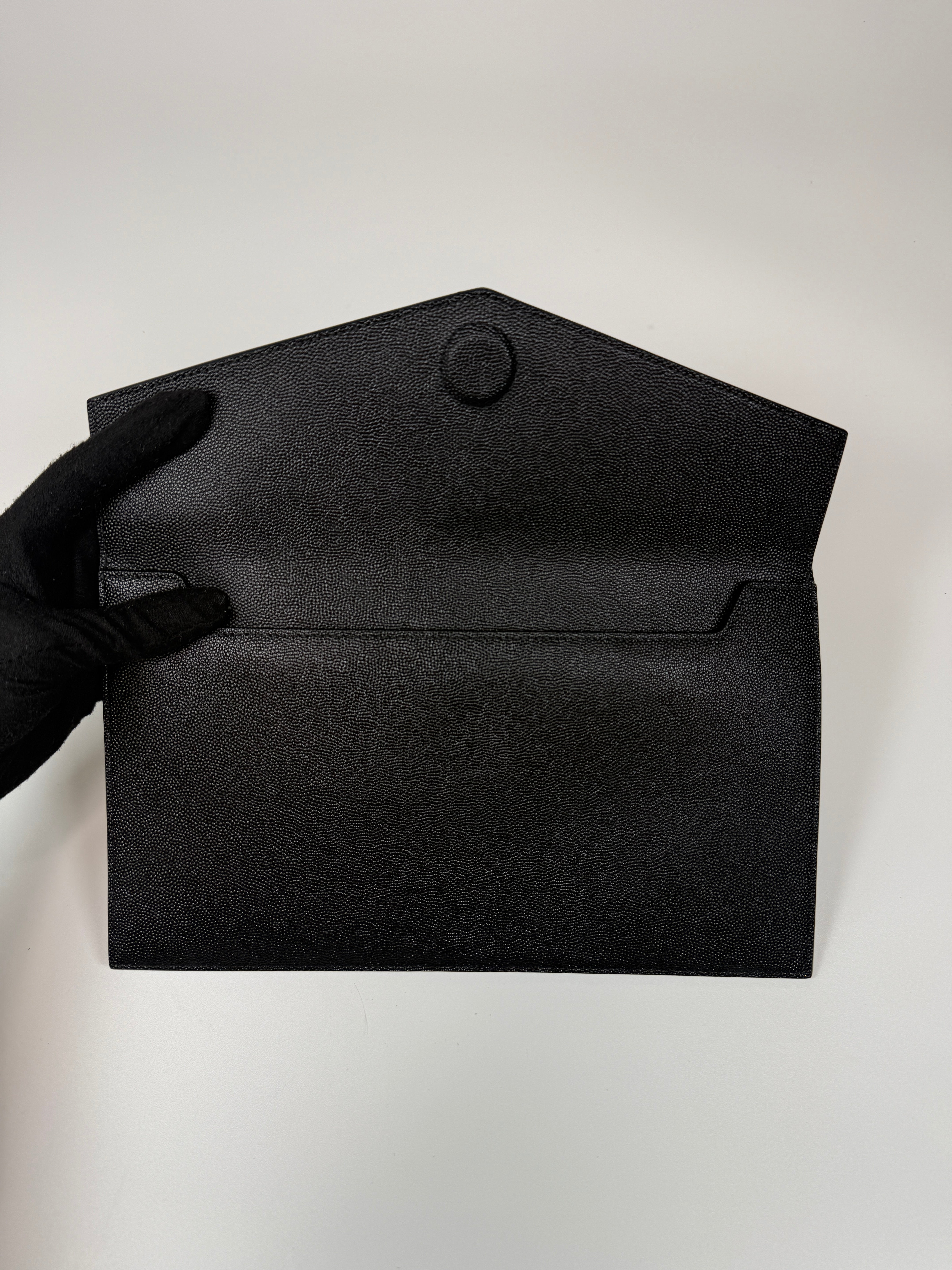 Saint Laurent Uptown Clutch In Black Leather With Gold Hardware. Authentic and preloved, 100% authenticity guarantee 