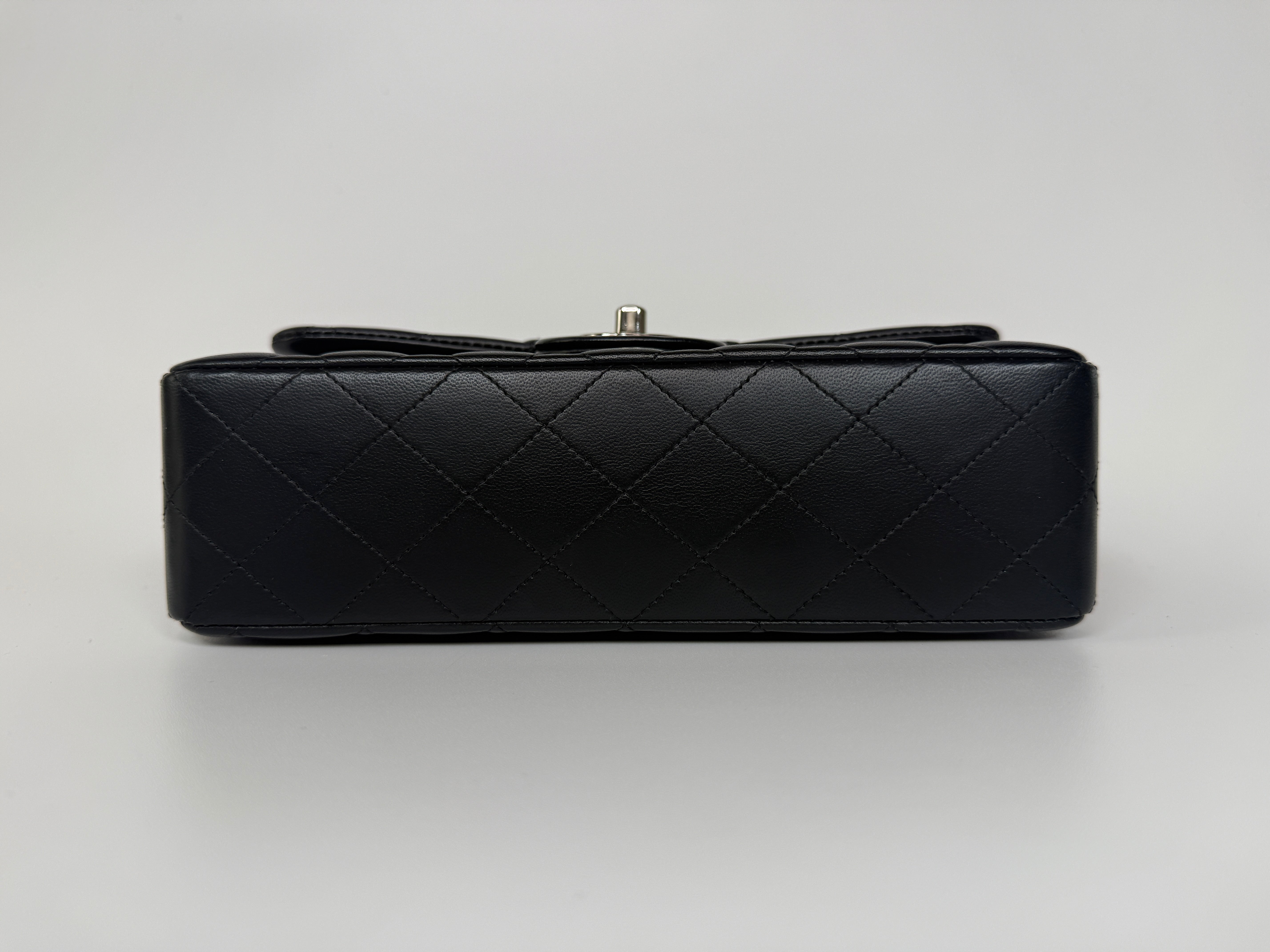 Authentic and preloved Chanel Small Classic Double Flap In Black Lambskin Leather With Silver hardware 100% Authenticity guarantee