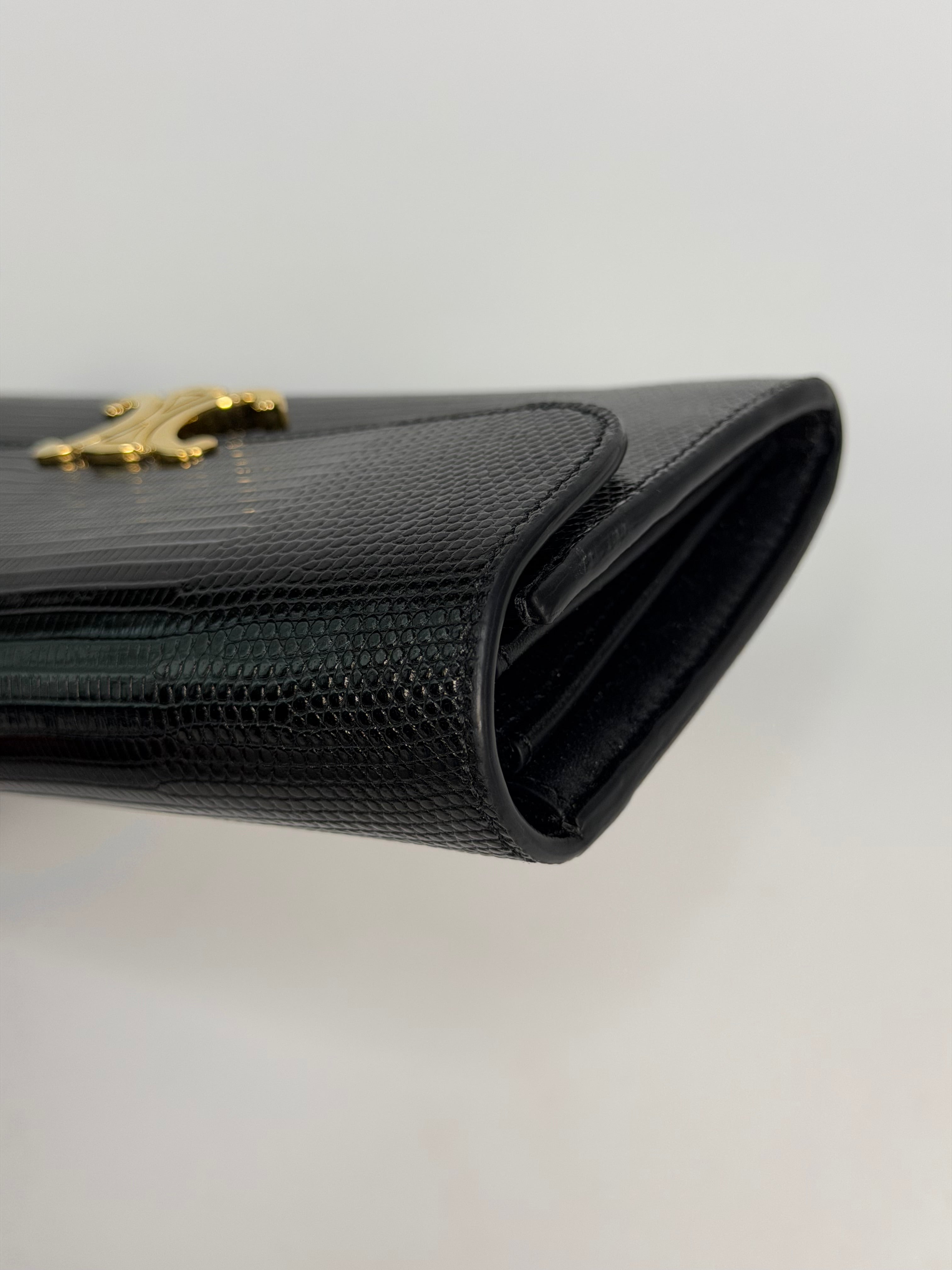 Celine Triomphe Wallet In Black Lizard Embossed Calfskin Gold Hardware. Authentic and preloved in excellent condition