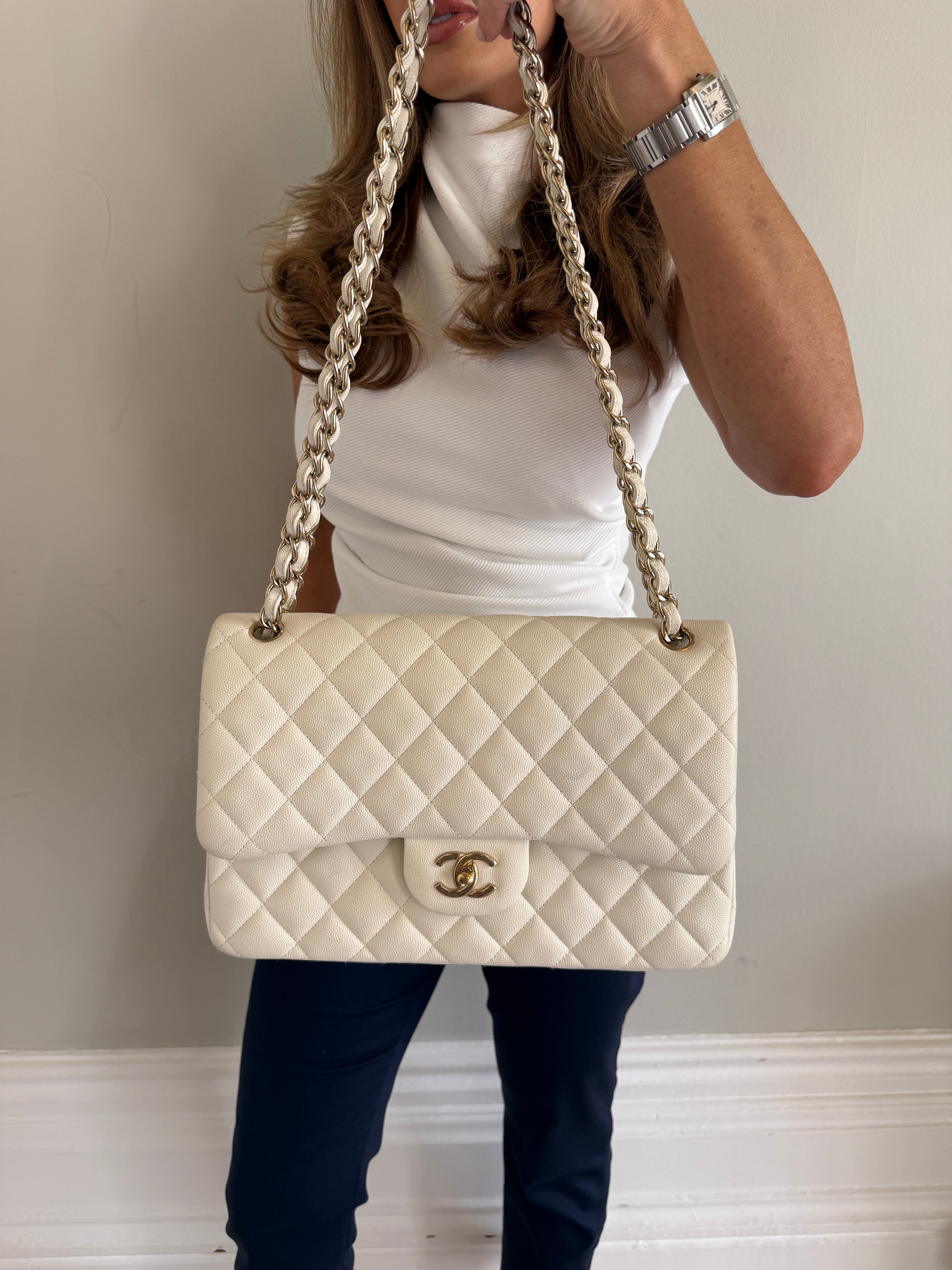 Authentic pre-loved Chanel Classic Jumbo Flap Bag In White Caviar Leather With pale gold  hardware in very good condition. Verified by Luxe Cheshire. International, fast  and fully insured delivery. Trusted designer resale.