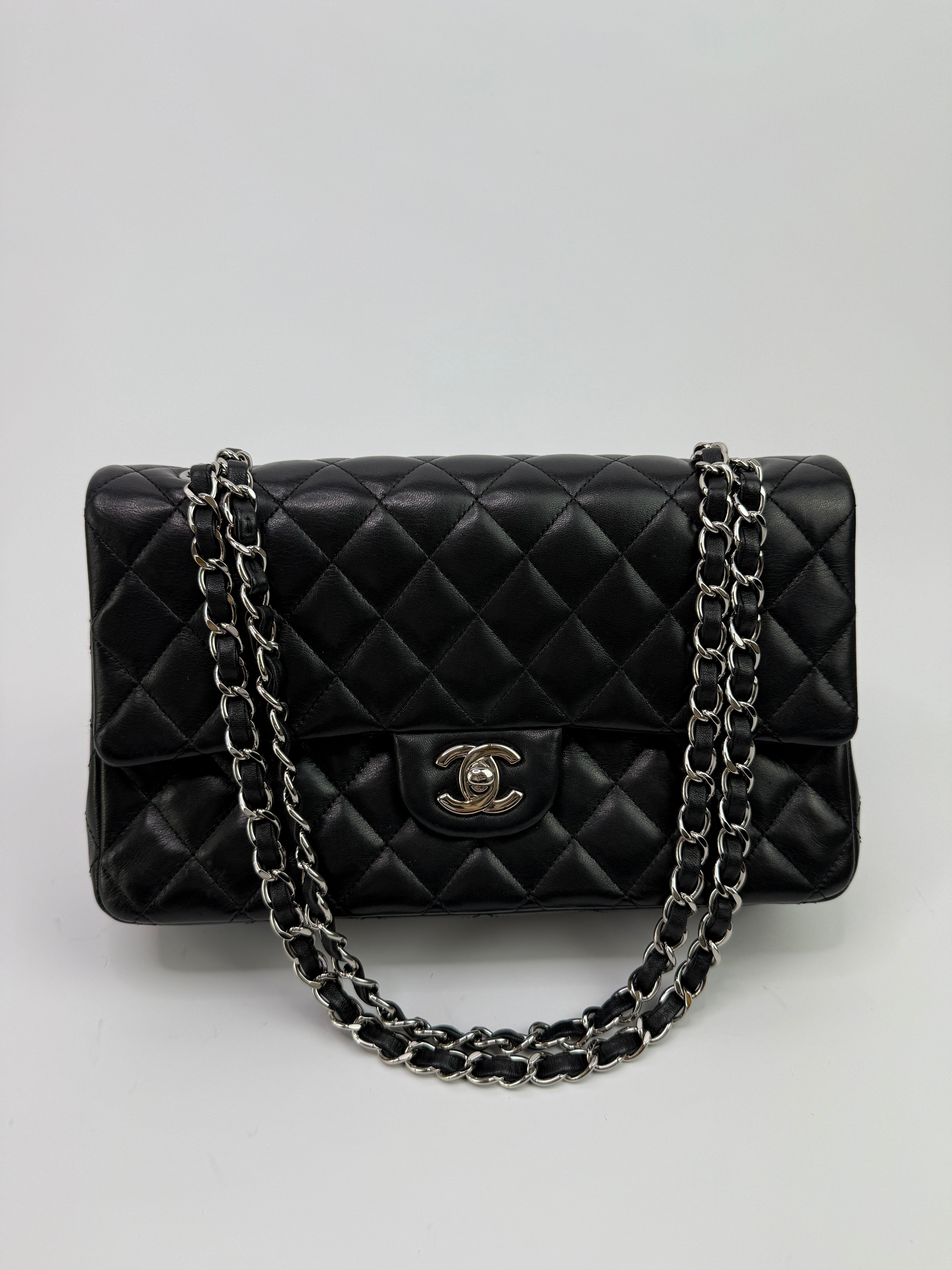 Authentic and preloved Chanel Medium Classic Double Flap Black Lambskin With Silver hardware Excellent condition. 100% Authenticity guarantee 