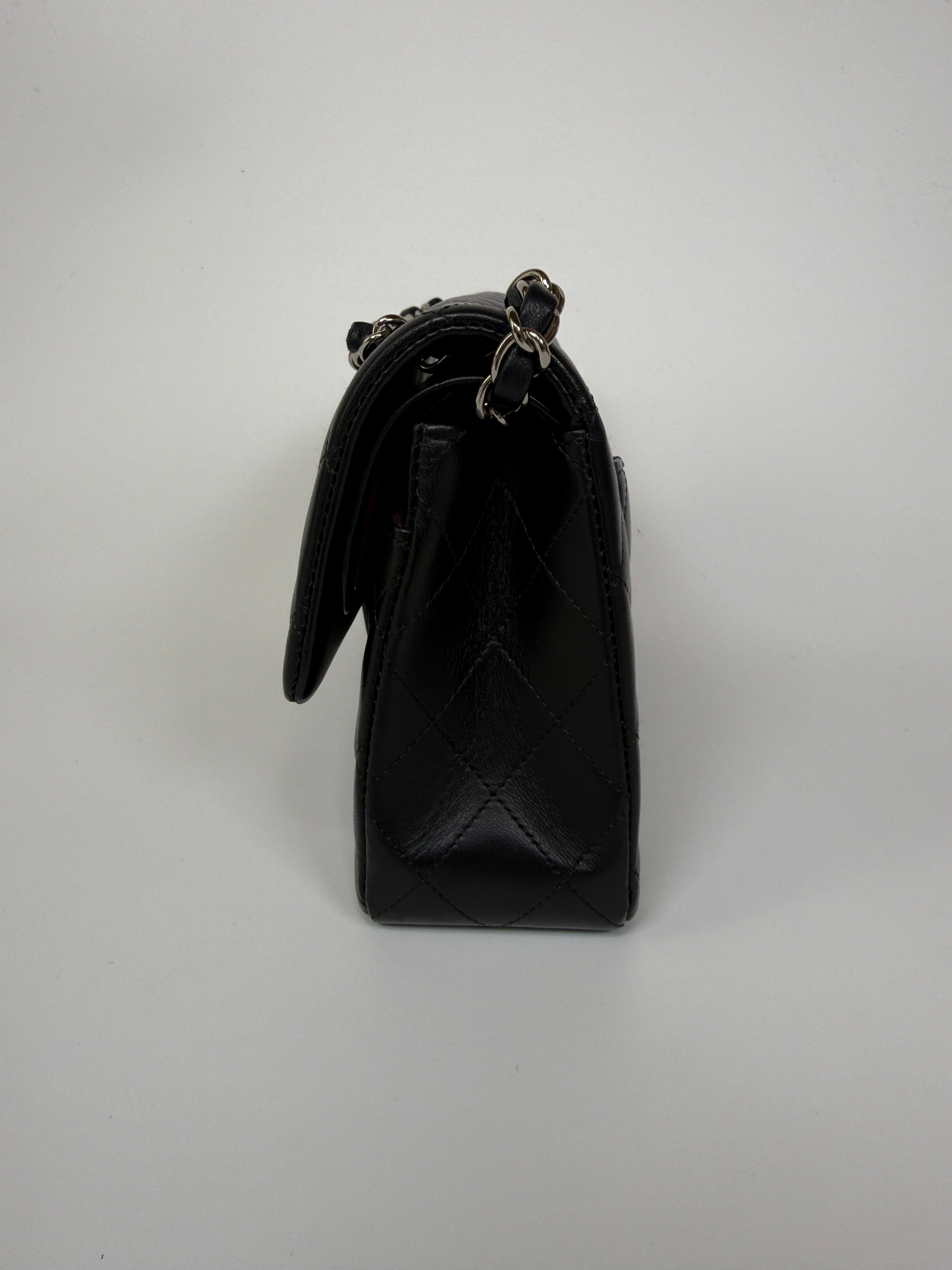 Authentic and preloved Chanel Small Classic Double Flap In Black Lambskin Leather With Silver hardware 100% Authenticity guarantee