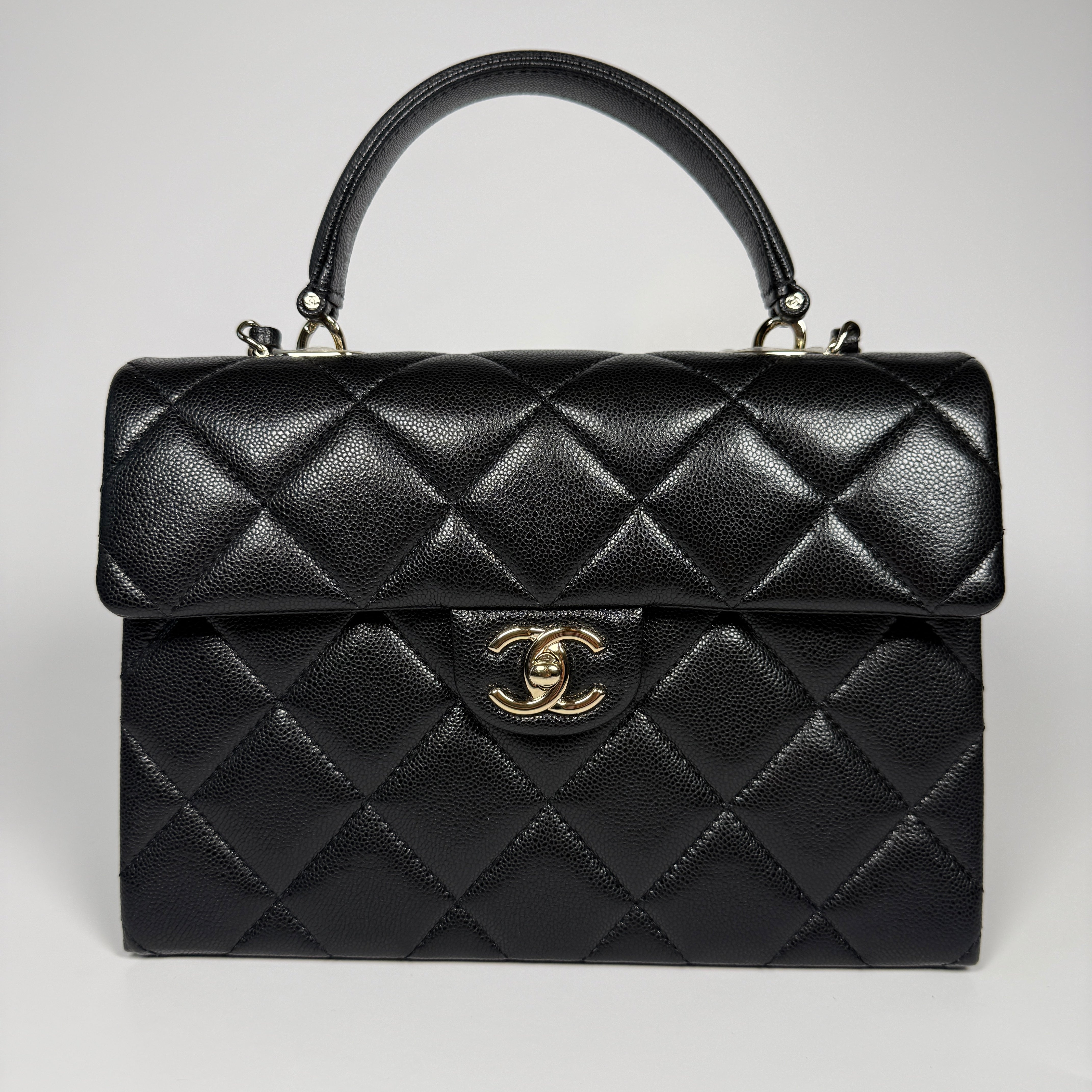 Chanel Retro Twist Top Handle Bag In Black Caviar Leather With Pale Gold Hardware. 100% Authentic and preloved in excellent condition.