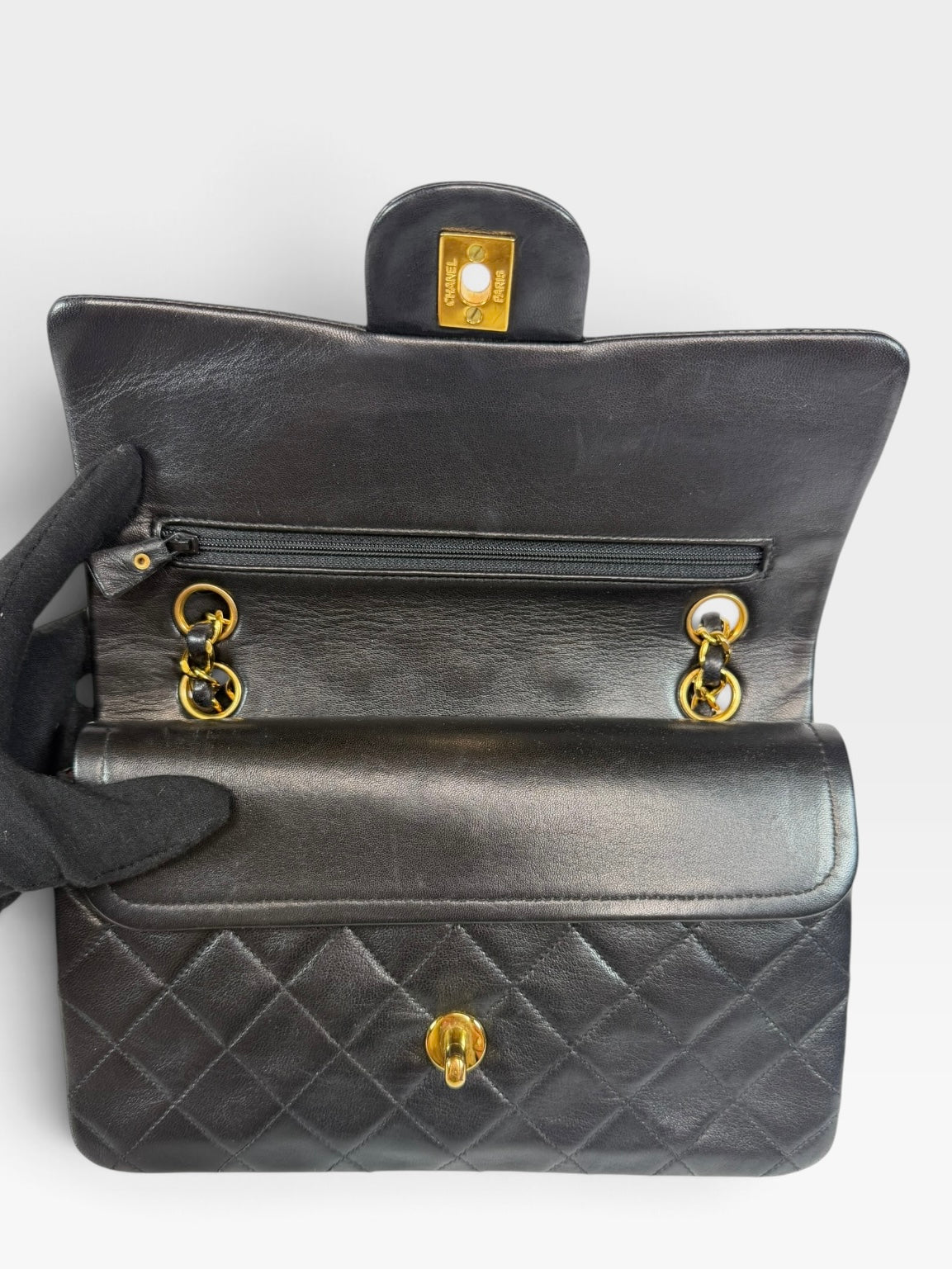 Chanel Vintage Small Classic Double Flap In Black Lambskin Leather 24Kt Hardware. Authentic and preloved in excellent condition. 100% guarantee