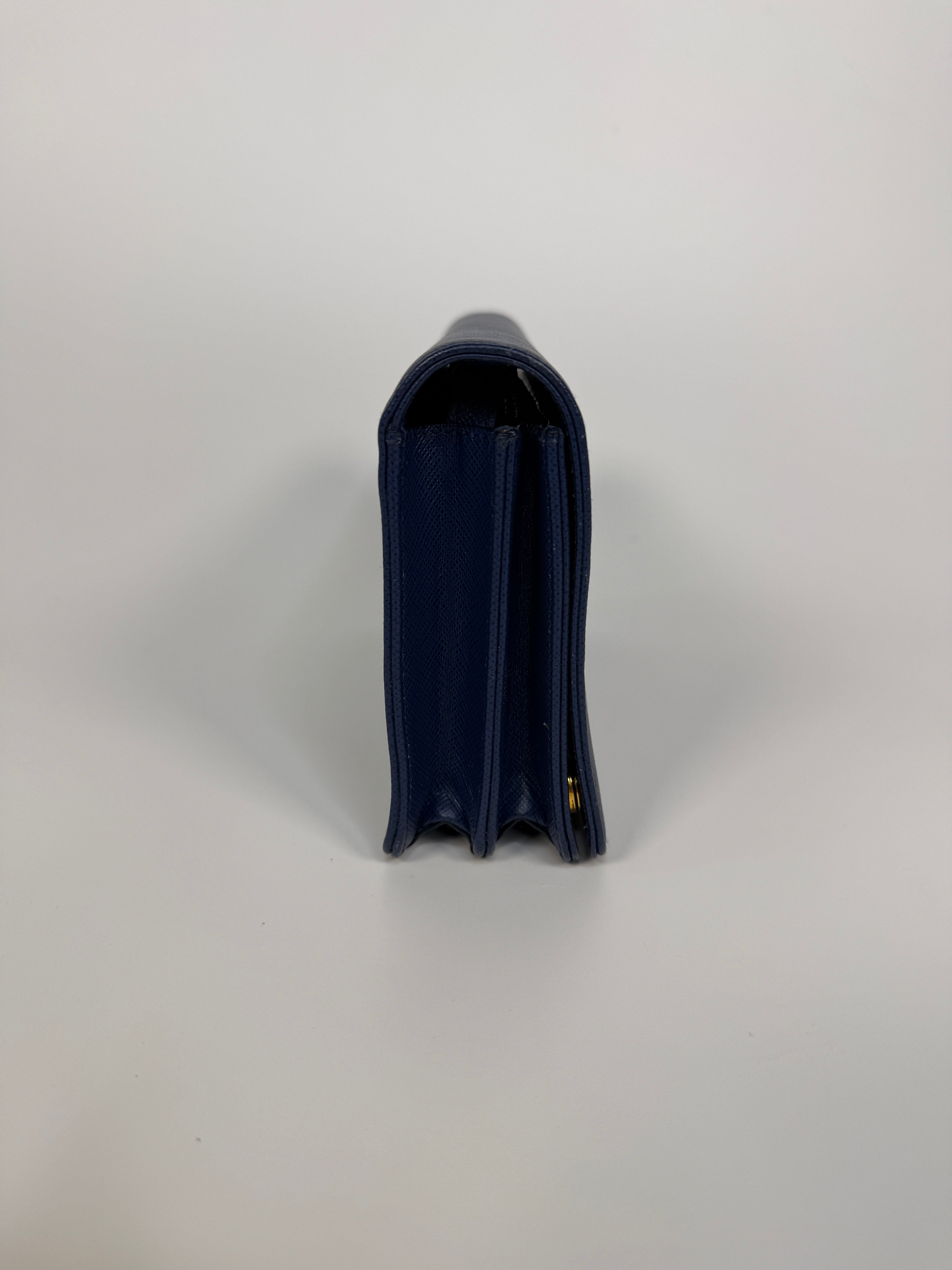 Authentic and preloved Prada Wallet Chain Bag In Blue Saffiano Leather With Gold Hardware. Very Good condition. 100% Authenticity guarantee 