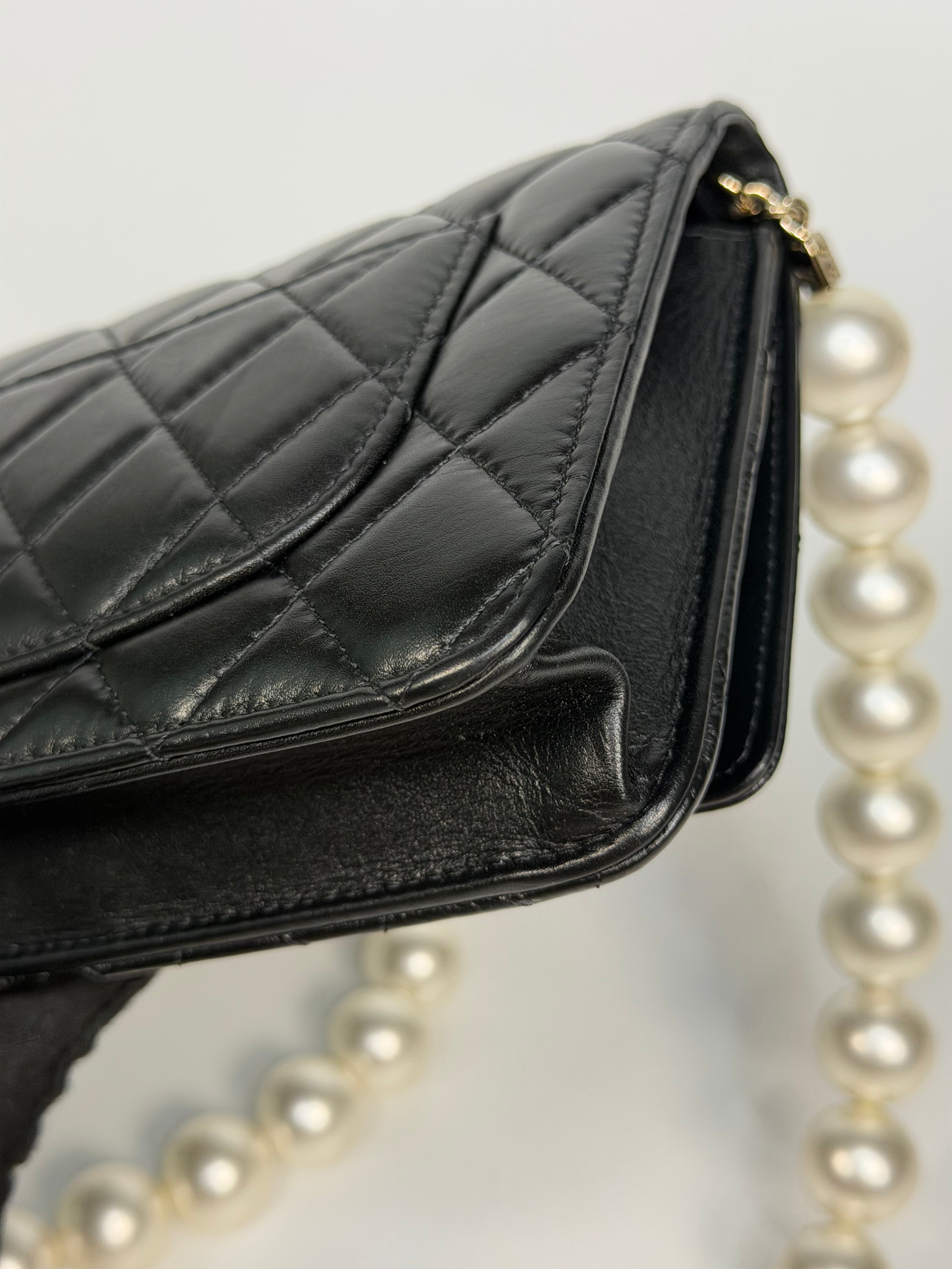 Chanel Pearl Wallet On Chain In Black Lambskin Leather With Gold Hardware. Authentic and preloved in very good condition.