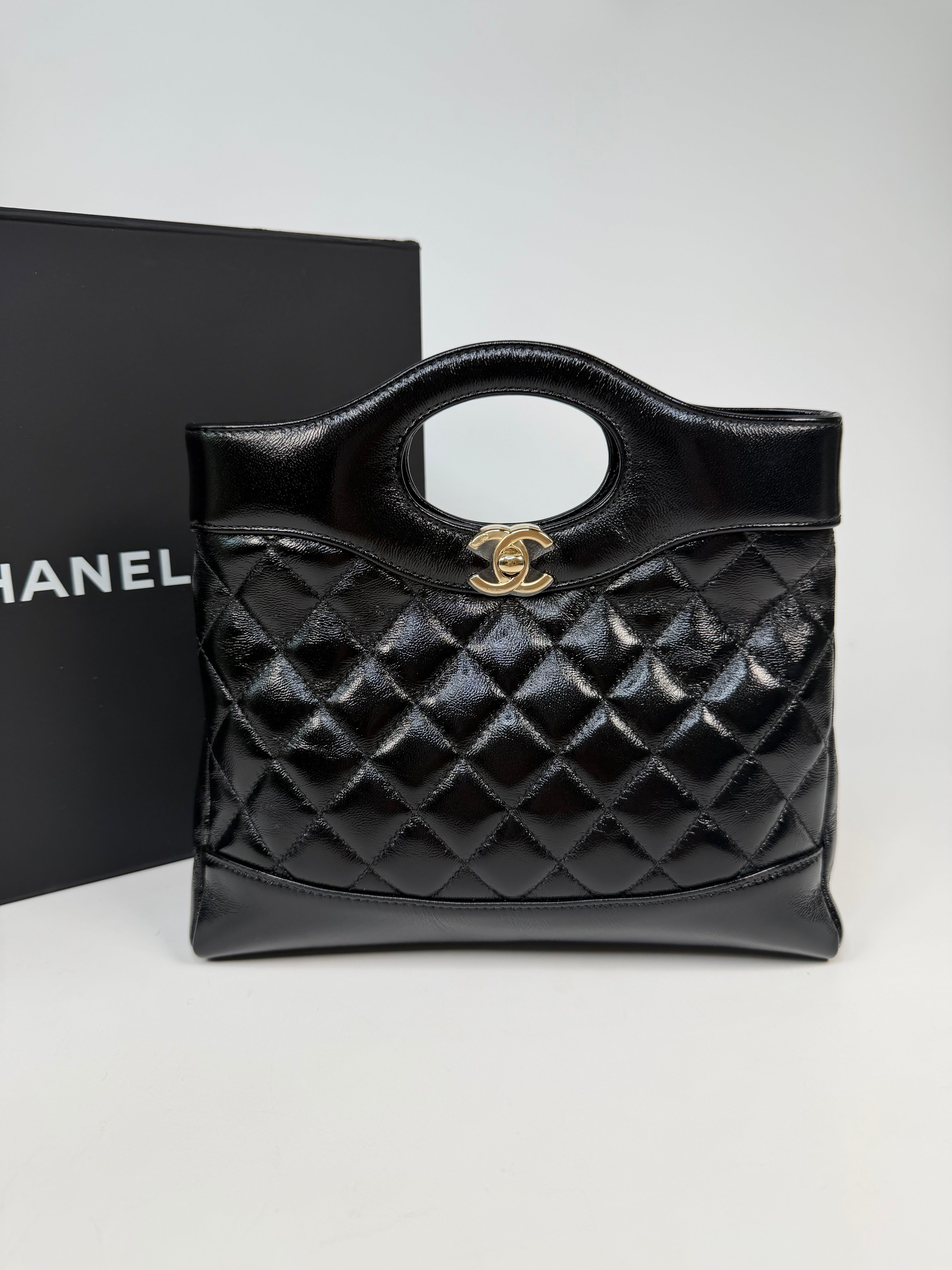 Chanel 31 Small In Black Calfskin Leather With Pale Gold Hardware
Excellent Condition, verified by Luxe Cheshire. Authentic and preloved