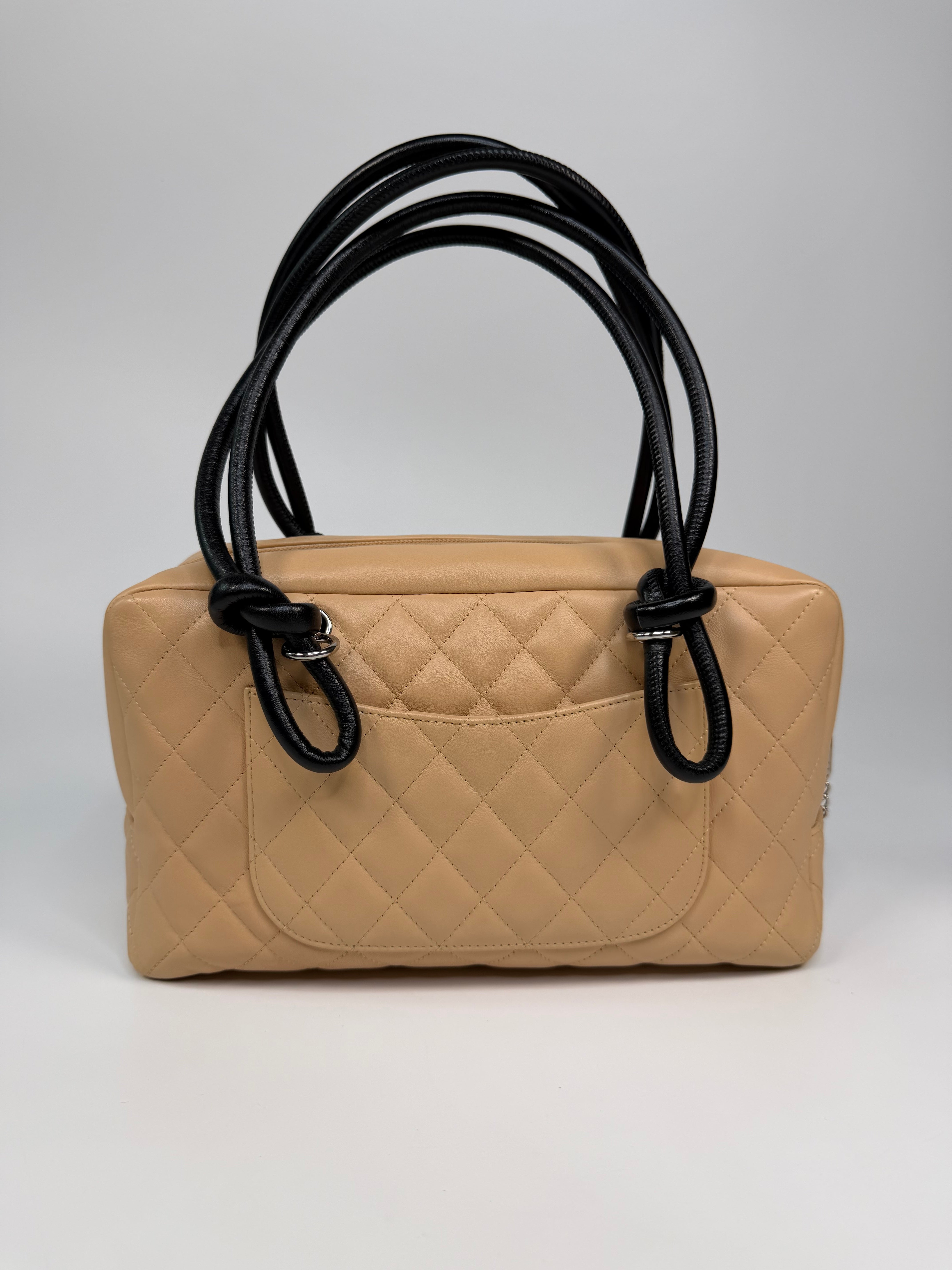 Chanel Cambon Bowling Bag In Beige / Black Leather With Silver Hardware. Authentic and preloved in excellent condition.