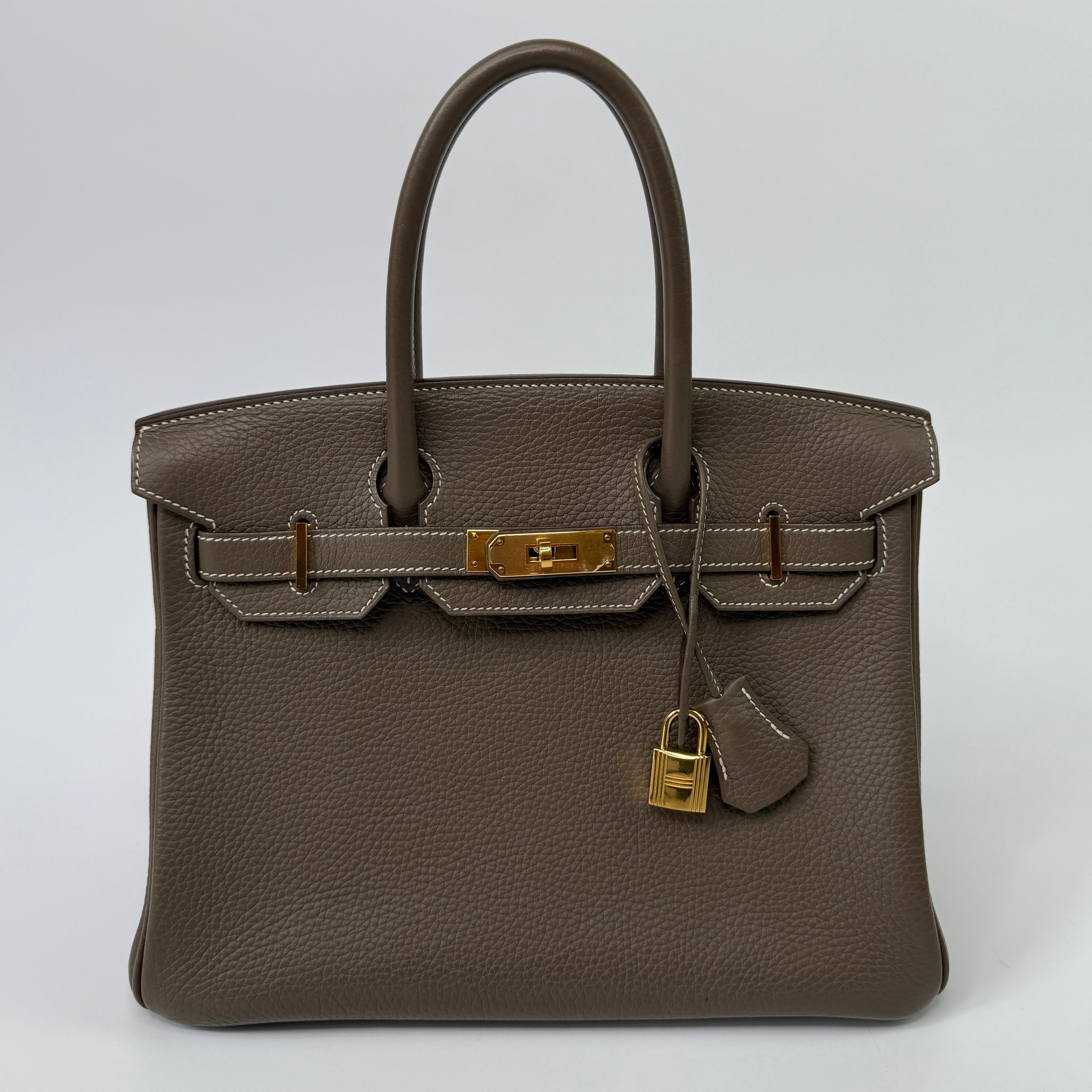 Authentic pre-loved Hermès Birkin 30 In Etoupe Togo Leather With Gold Hardware.