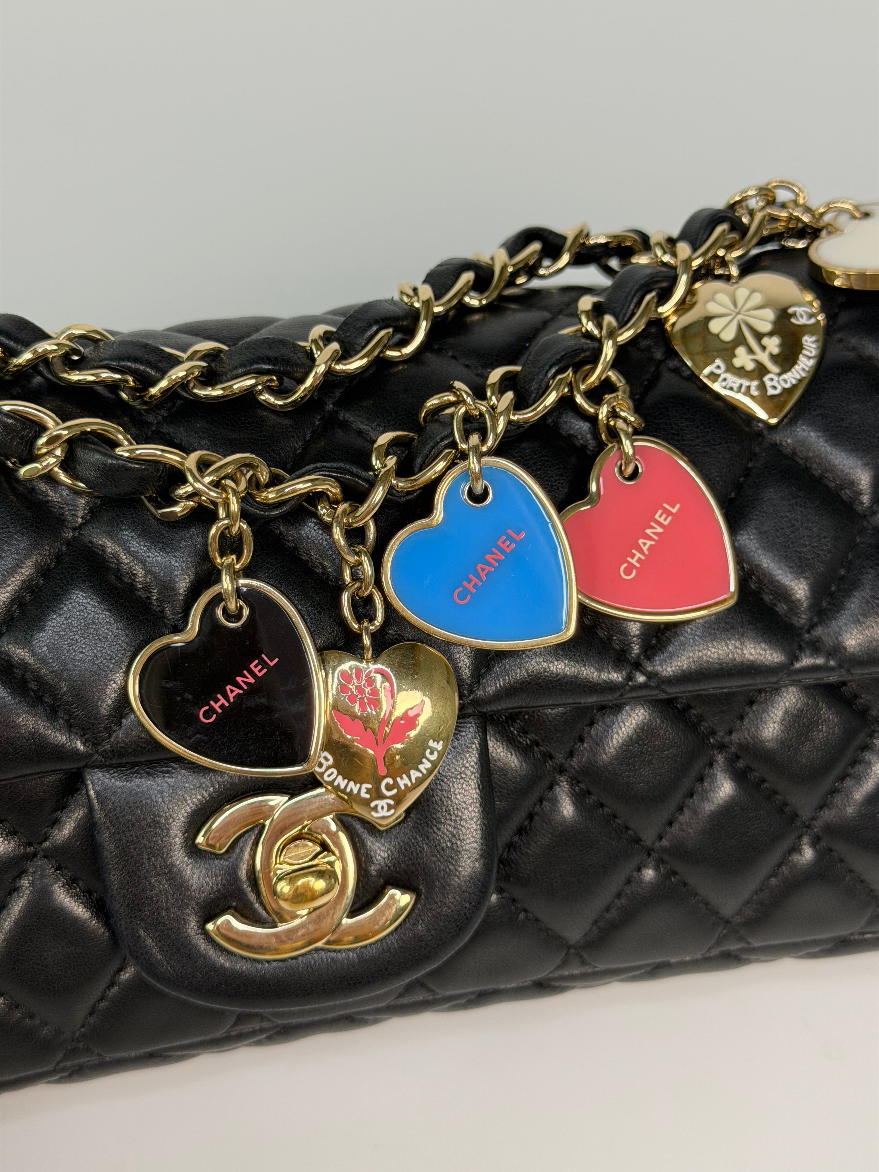 Chanel East West Charms Bag In Black Lambskin Leather With Gold Hardware. Authentic and preloved in excellent condition. 100% guarantee