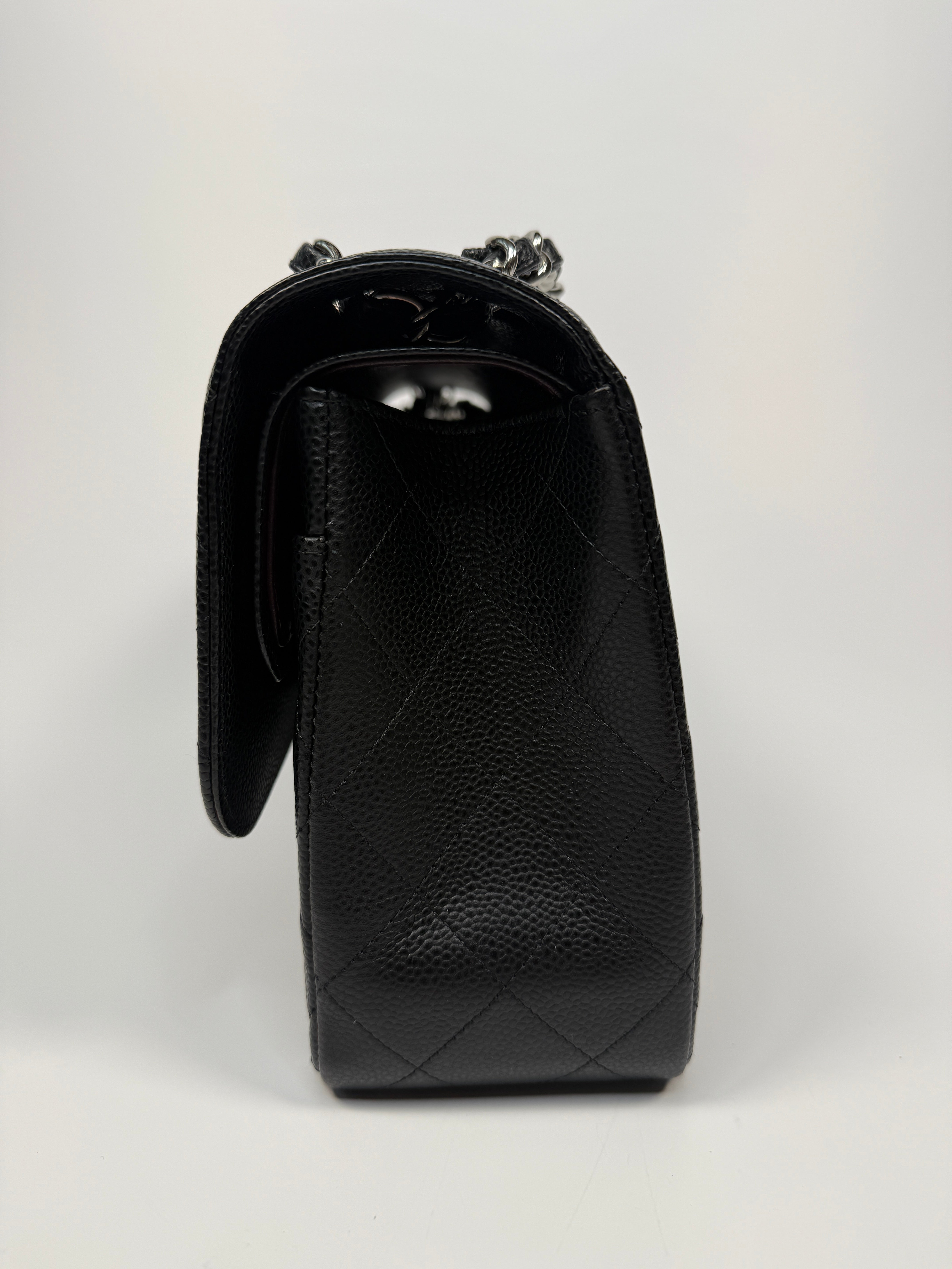 Chanel Classic Jumbo Flap Bag In Black Caviar Leather With Silver Hardware. Authentic and preloved. Excellent condition.