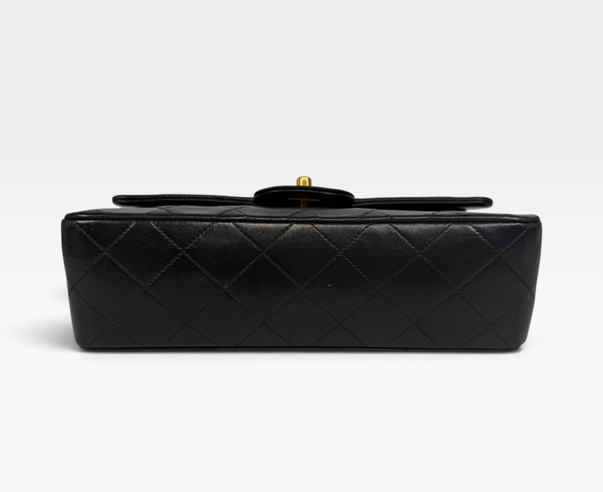 Chanel Vintage Small Classic Double Flap In Black Lambskin Leather 24Kt Hardware. Authentic and preloved in excellent condition. 100% guarantee