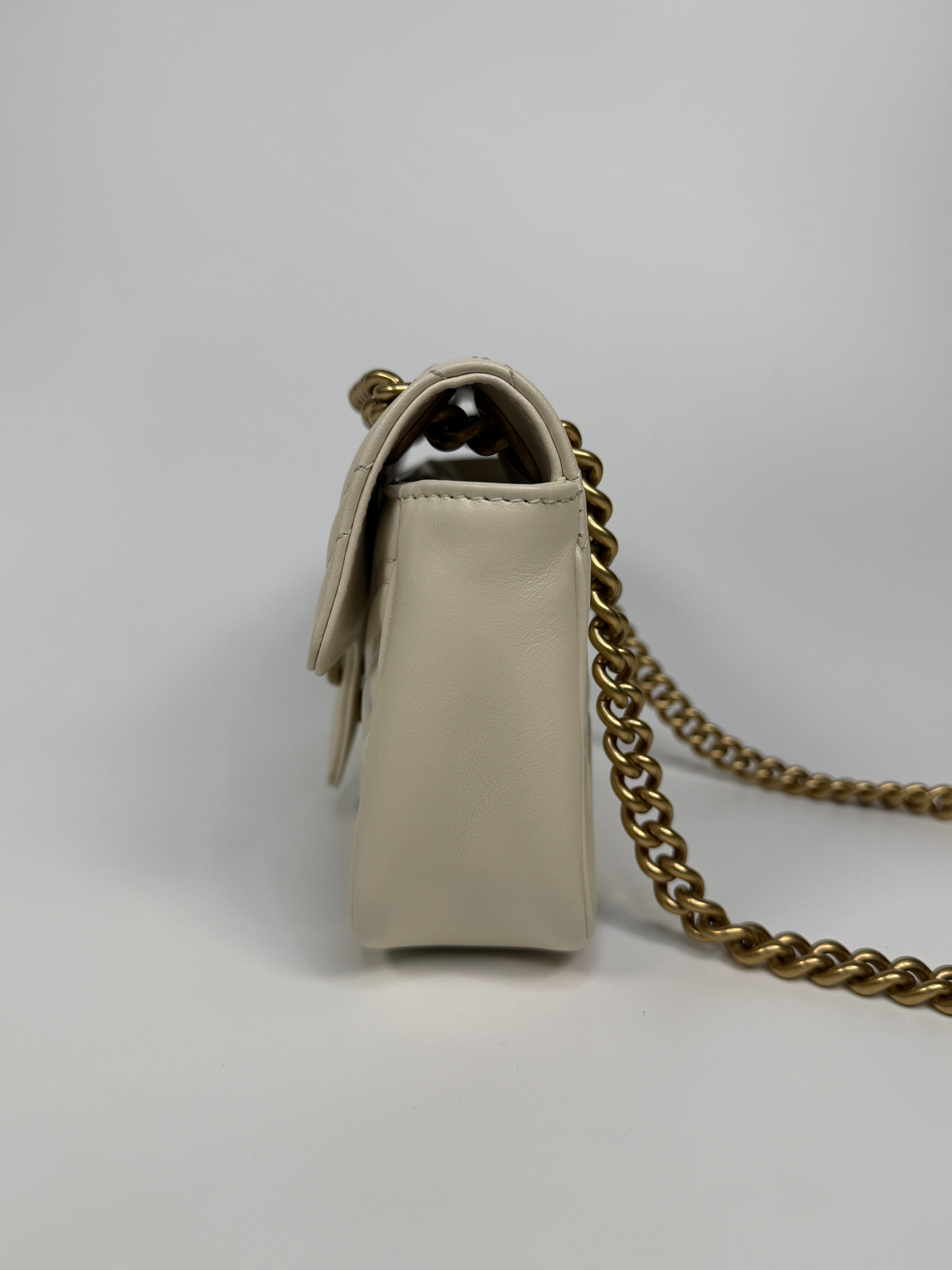 Gucci GG Small Marmont Matelasse Shoulder Bag In Ivory Leather With Gold Hardware 