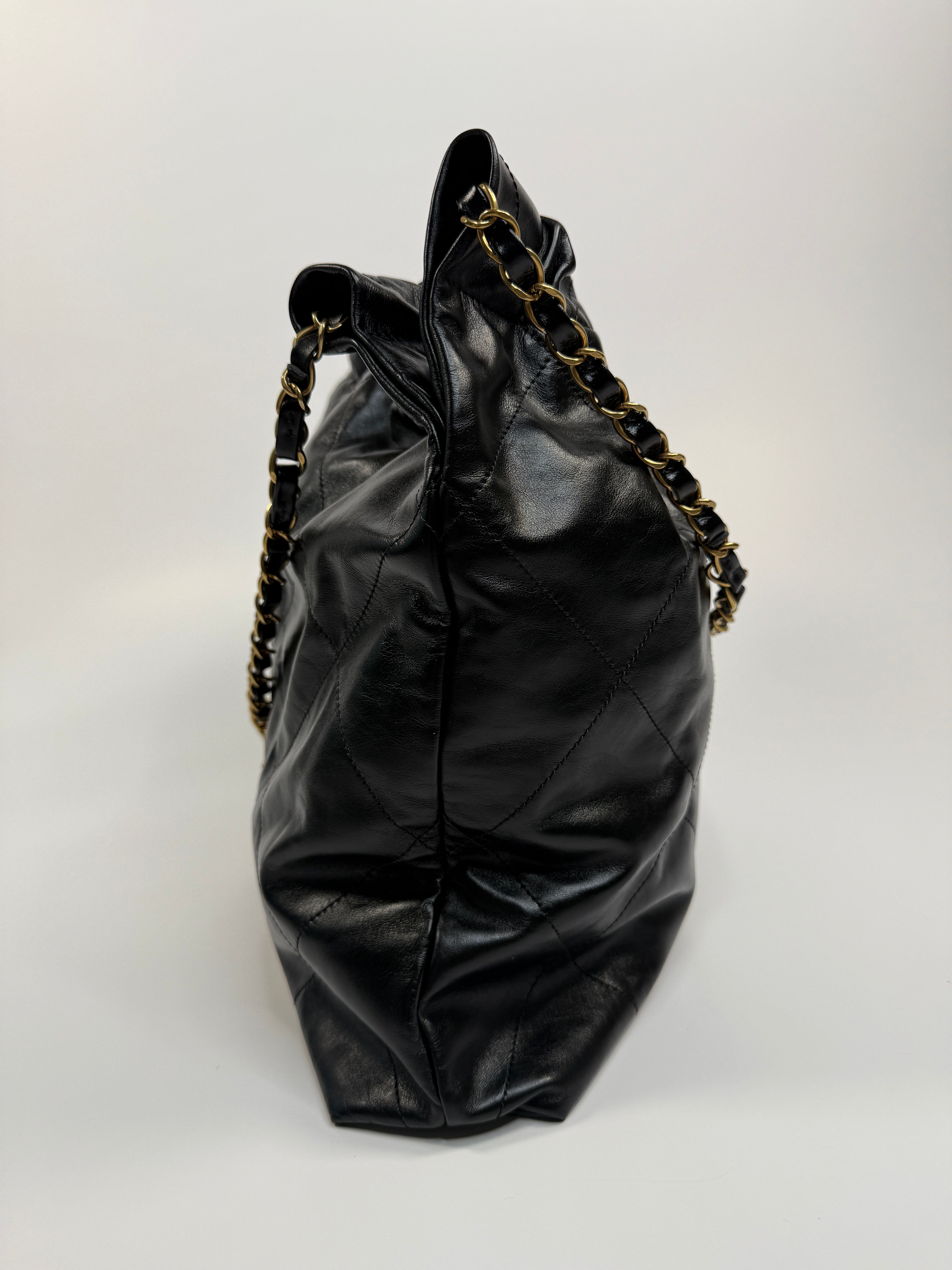 Chanel 22 Handbag In Black Calfskin Leather With Gold Hardware. Excellent Condition. Authentic and Preloved