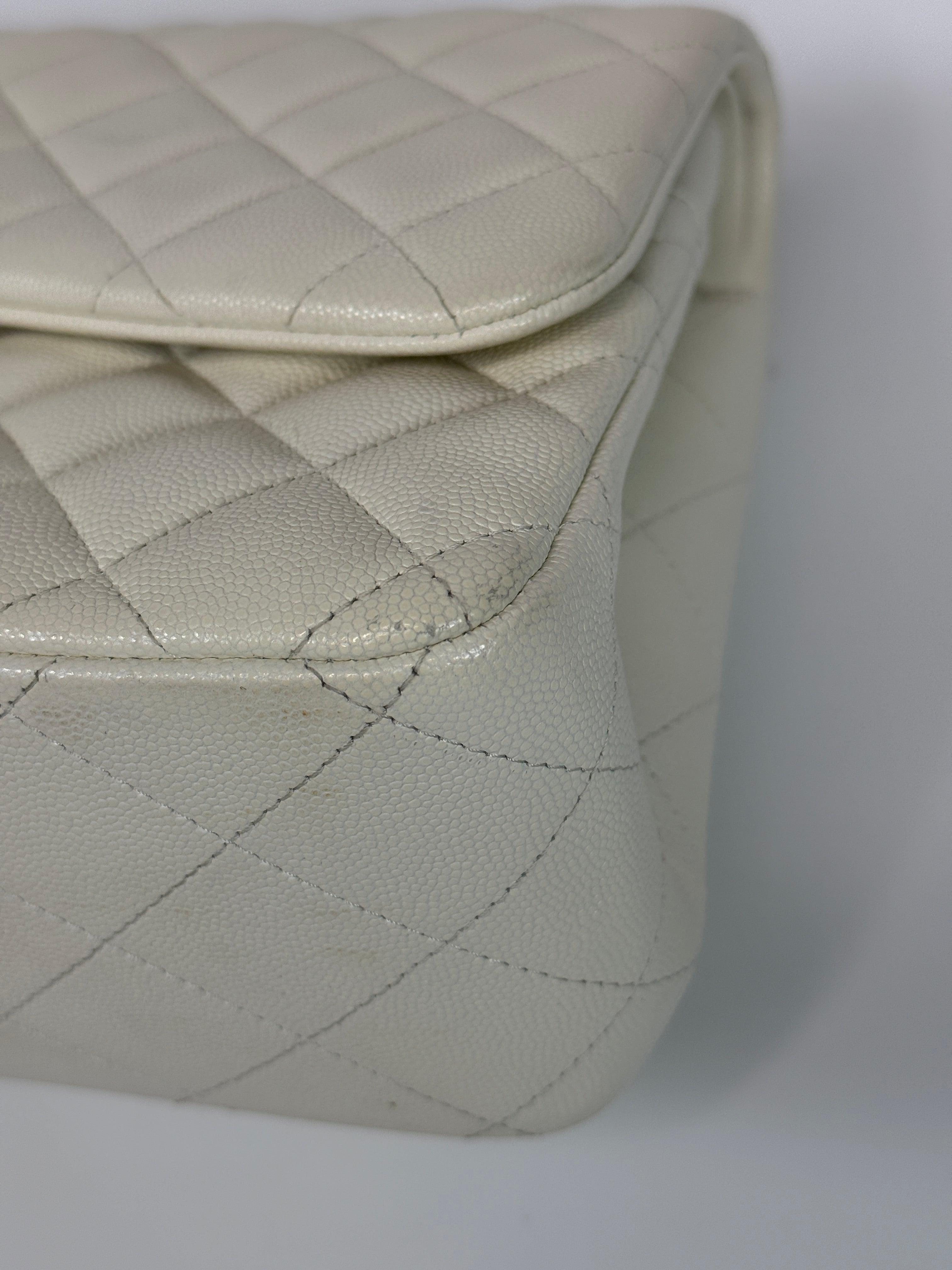 Authentic pre-loved Chanel Classic Jumbo Flap Bag In White Caviar Leather With pale gold  hardware in very good condition. Verified by Luxe Cheshire. International, fast  and fully insured delivery. Trusted designer resale.