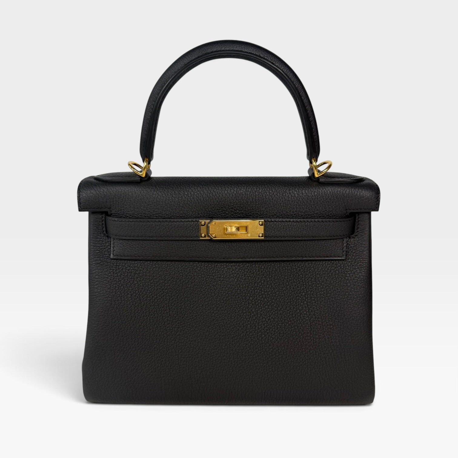 Authentic pre-loved Hermès Kelly 28 In Black Togo Leather Gold Hardware. New and Unused condition, verified by Luxe Cheshire. Trusted designer resale.