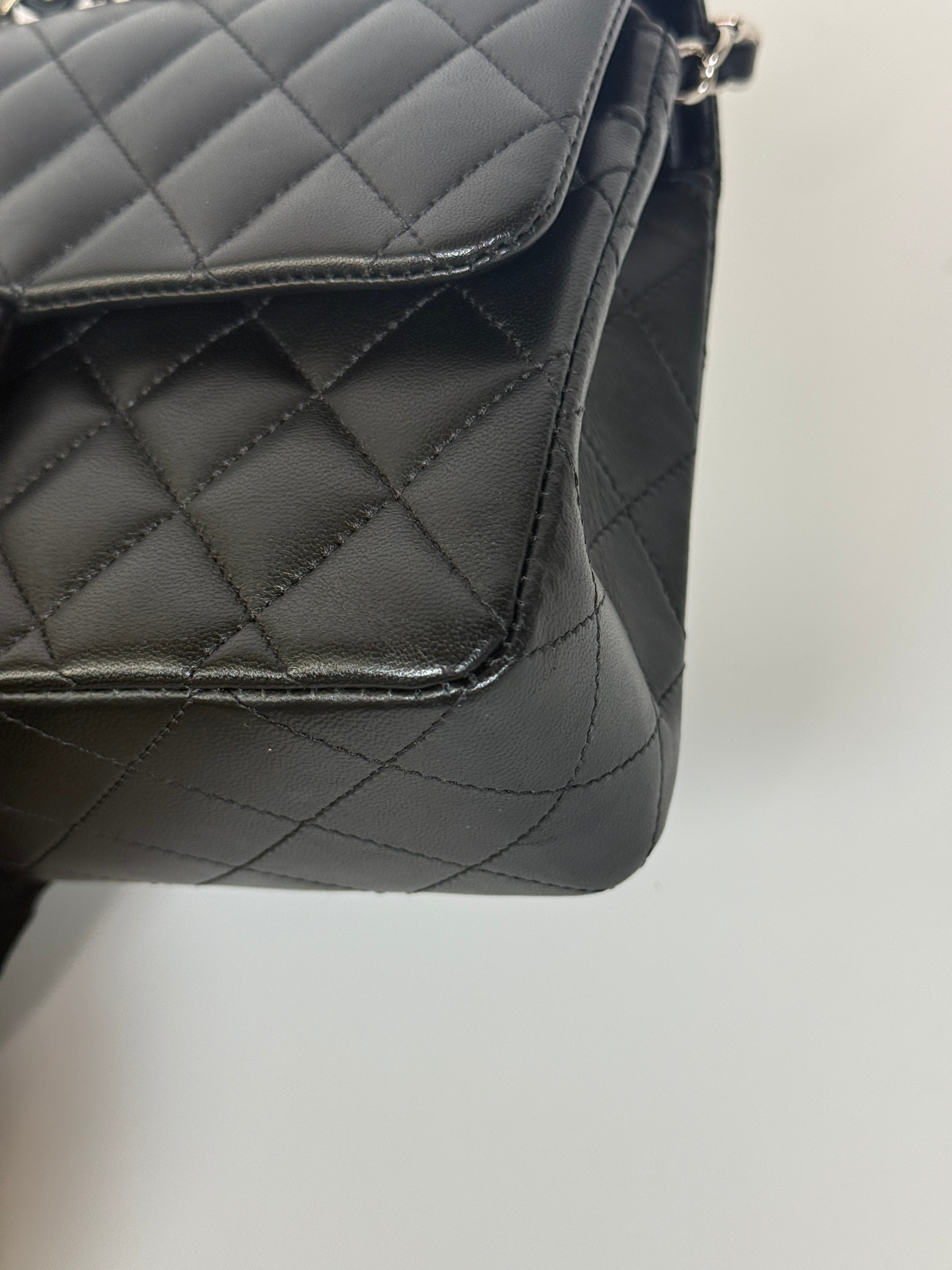 Authentic and preloved Chanel Small Classic Double Flap In Black Lambskin Leather With Silver hardware 100% Authenticity guarantee