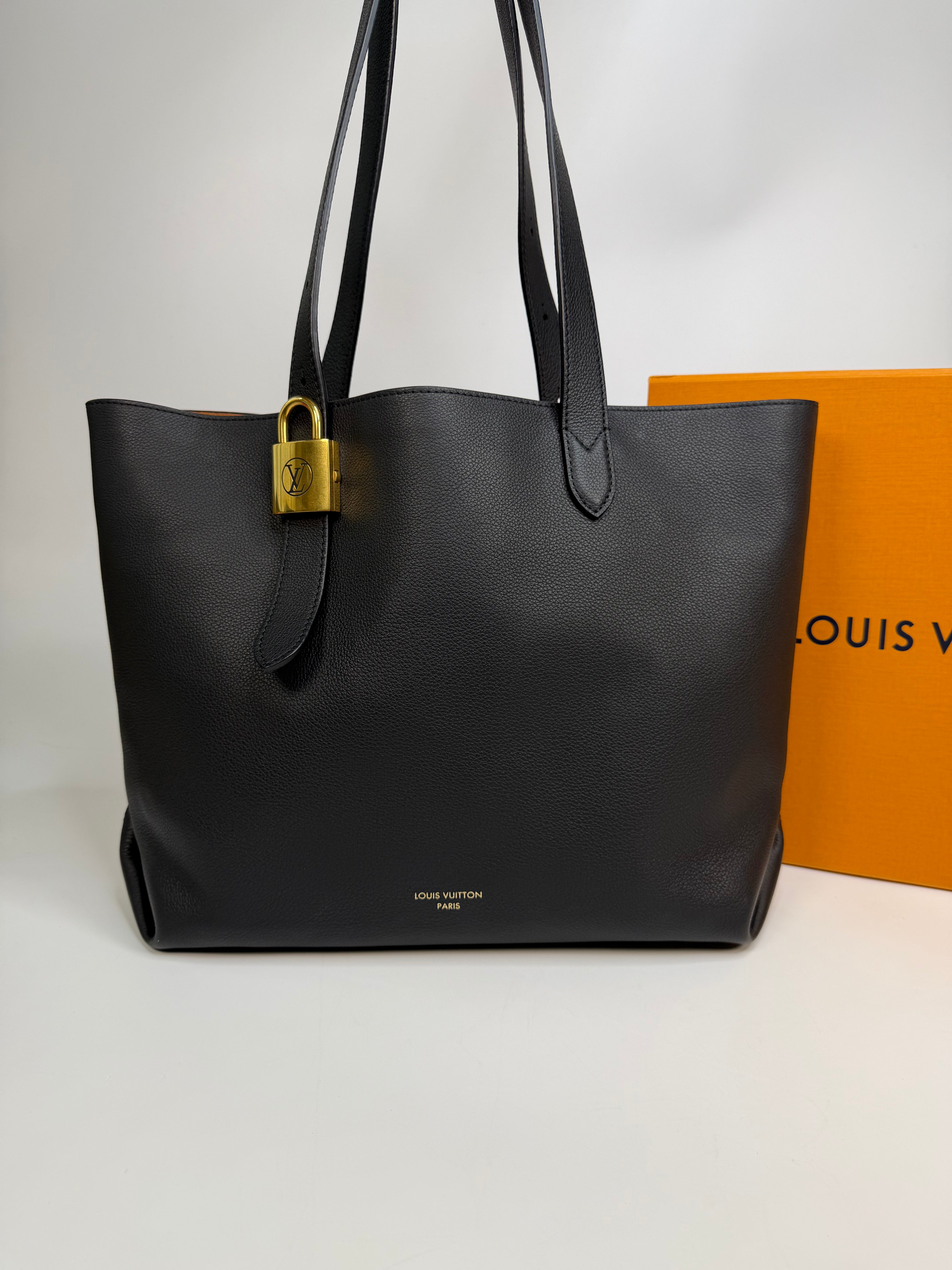 Louis Vuitton Low Key Cabas MM In Black Calfskin With Gold Hardware. Authentic and preloved in excellent condition
