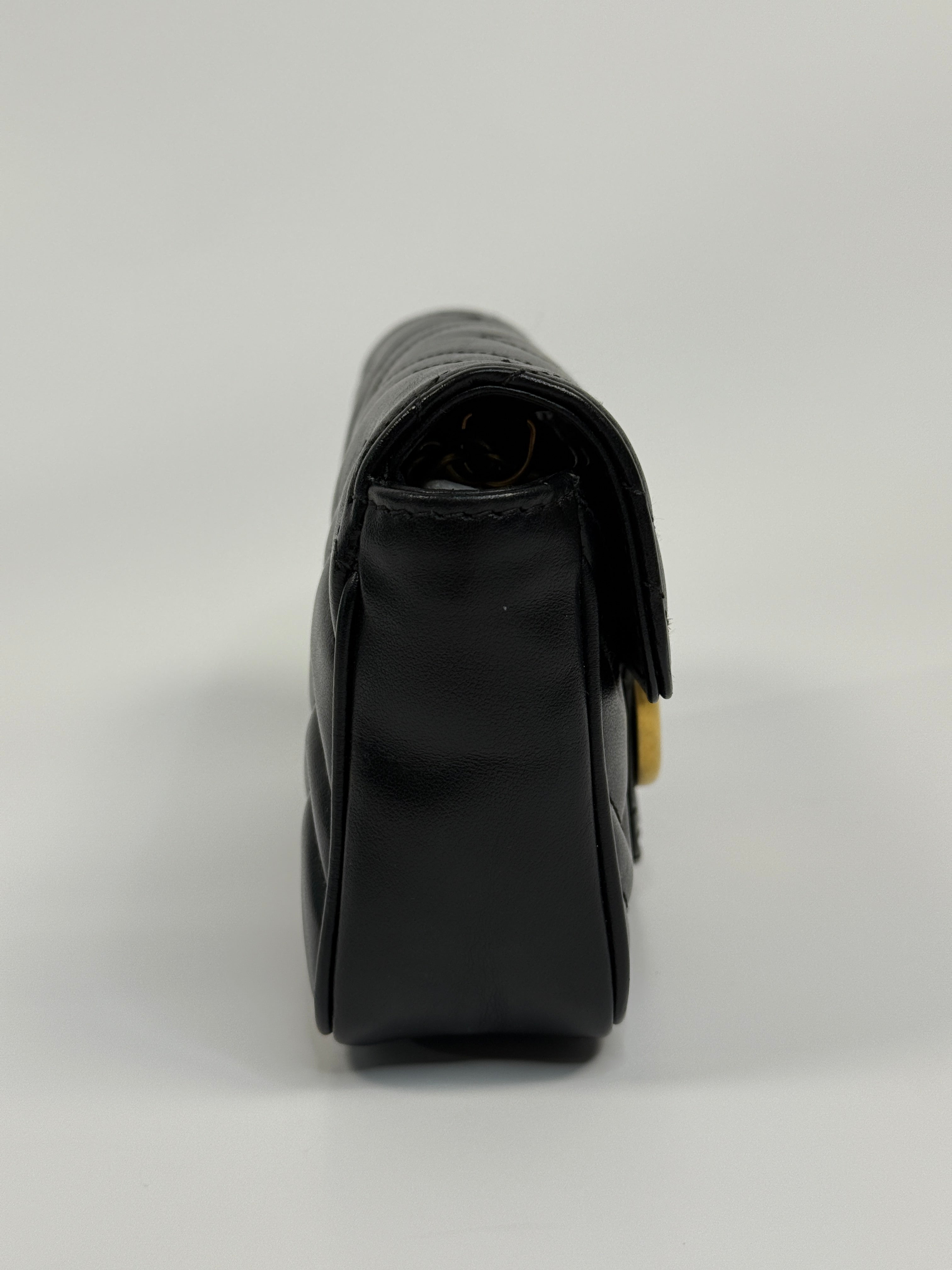 Authentic and preloved Gucci Marmont Matelassé Super Mini Bag In Black Leather With Gold Hardware in excellent condition 