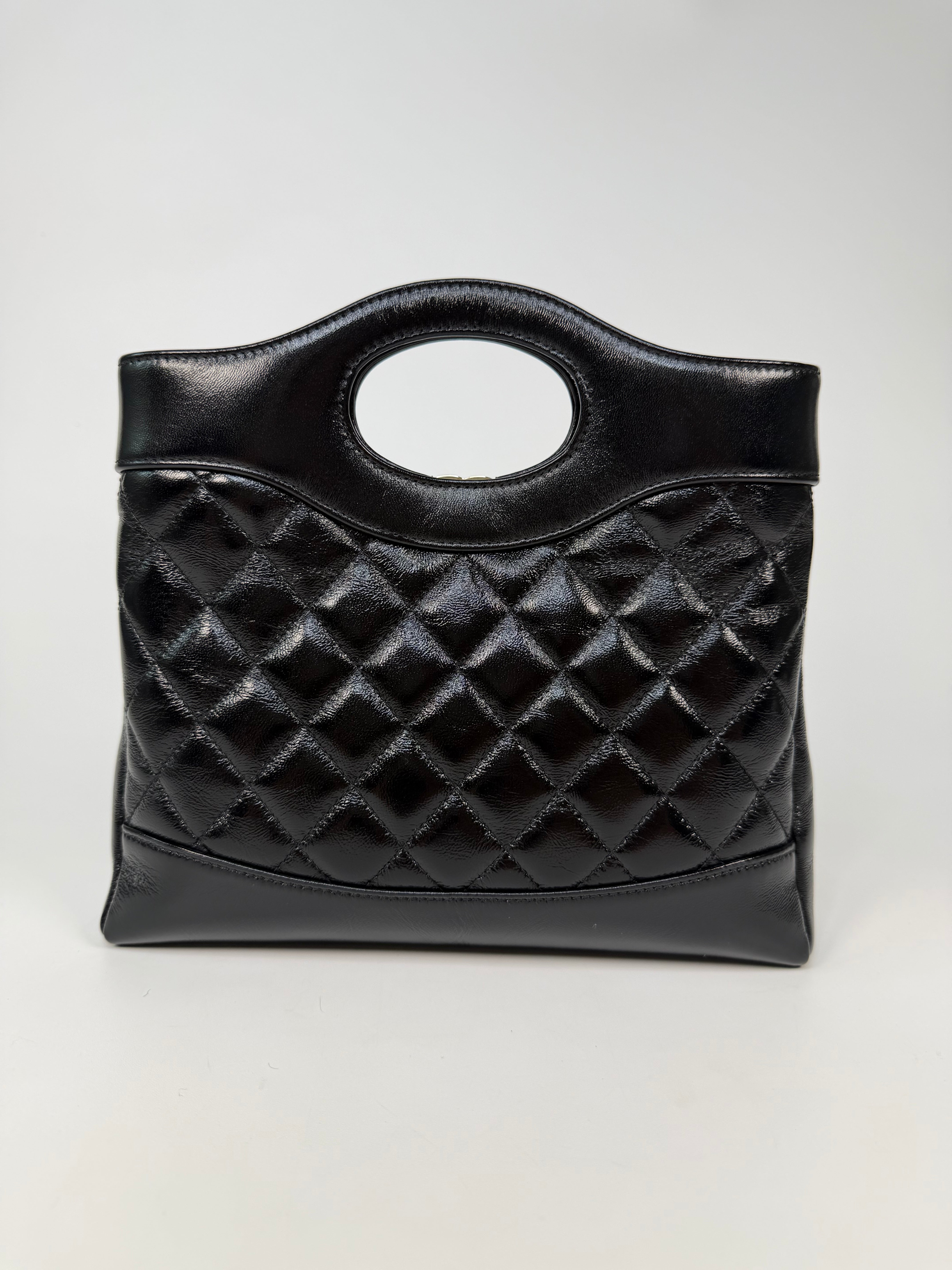 Chanel 31 Small In Black Calfskin Leather With Pale Gold Hardware
Excellent Condition, verified by Luxe Cheshire. Authentic and preloved