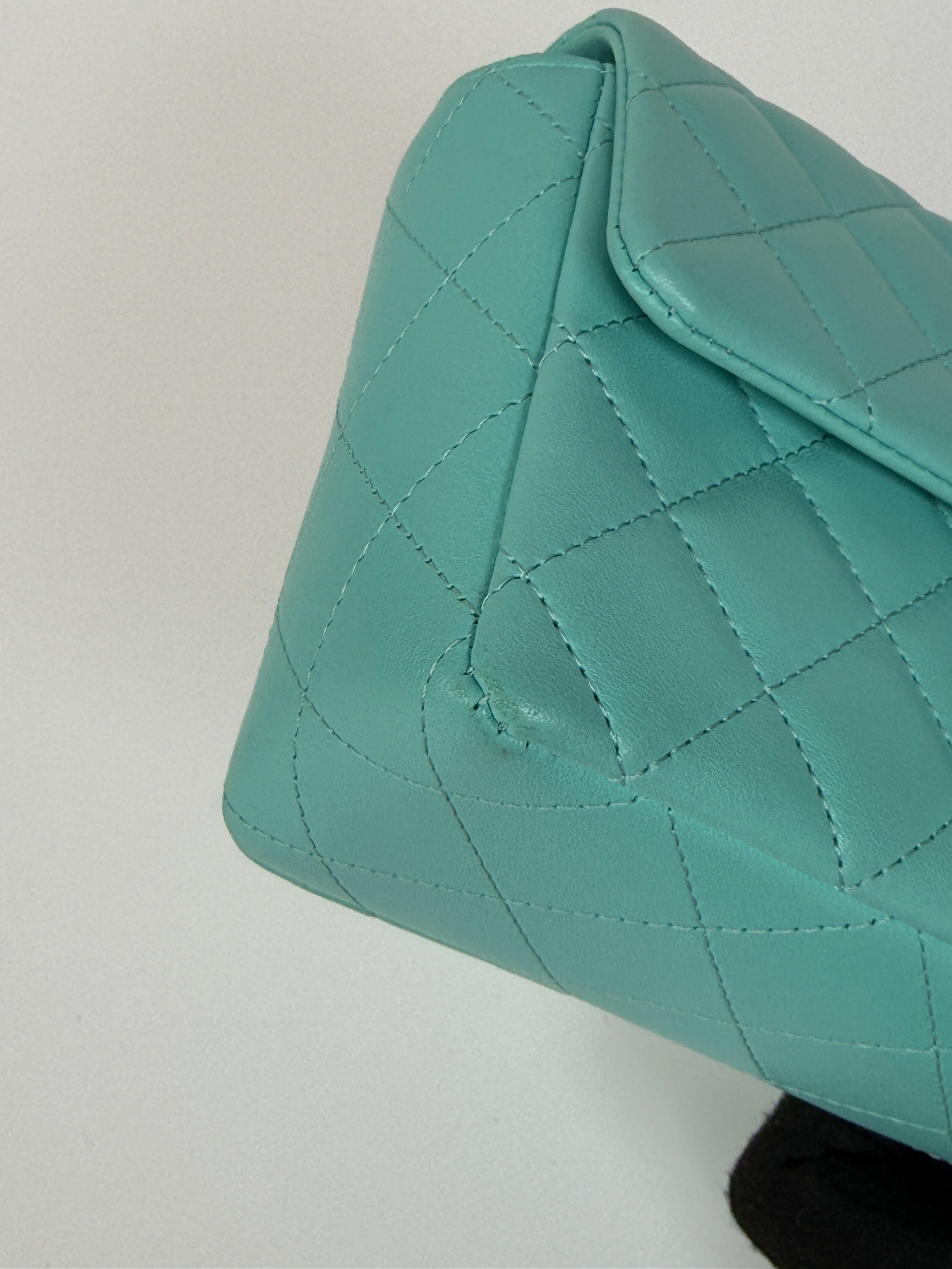 Authentic and preloved Chanel Mini Rectangle Flap Bag In Turquoise Lambskin Leather With Gunmetal Hardware In Excellent condition. Verified by Luxe Cheshire. 100% Authenticity Guarantee. 