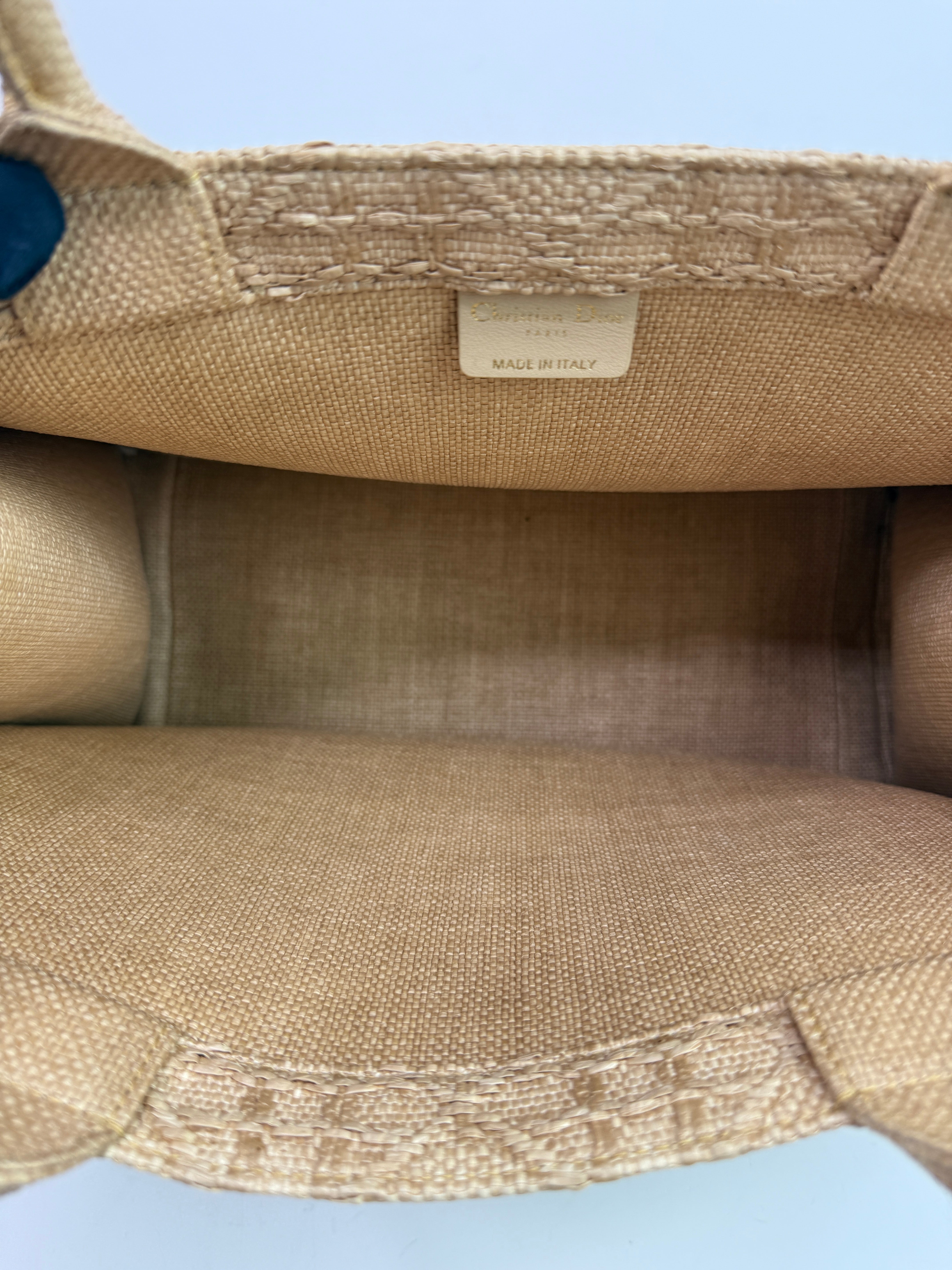 Authentic pre-loved Christian Dior Medium Raffia Cannage Book Tote. 