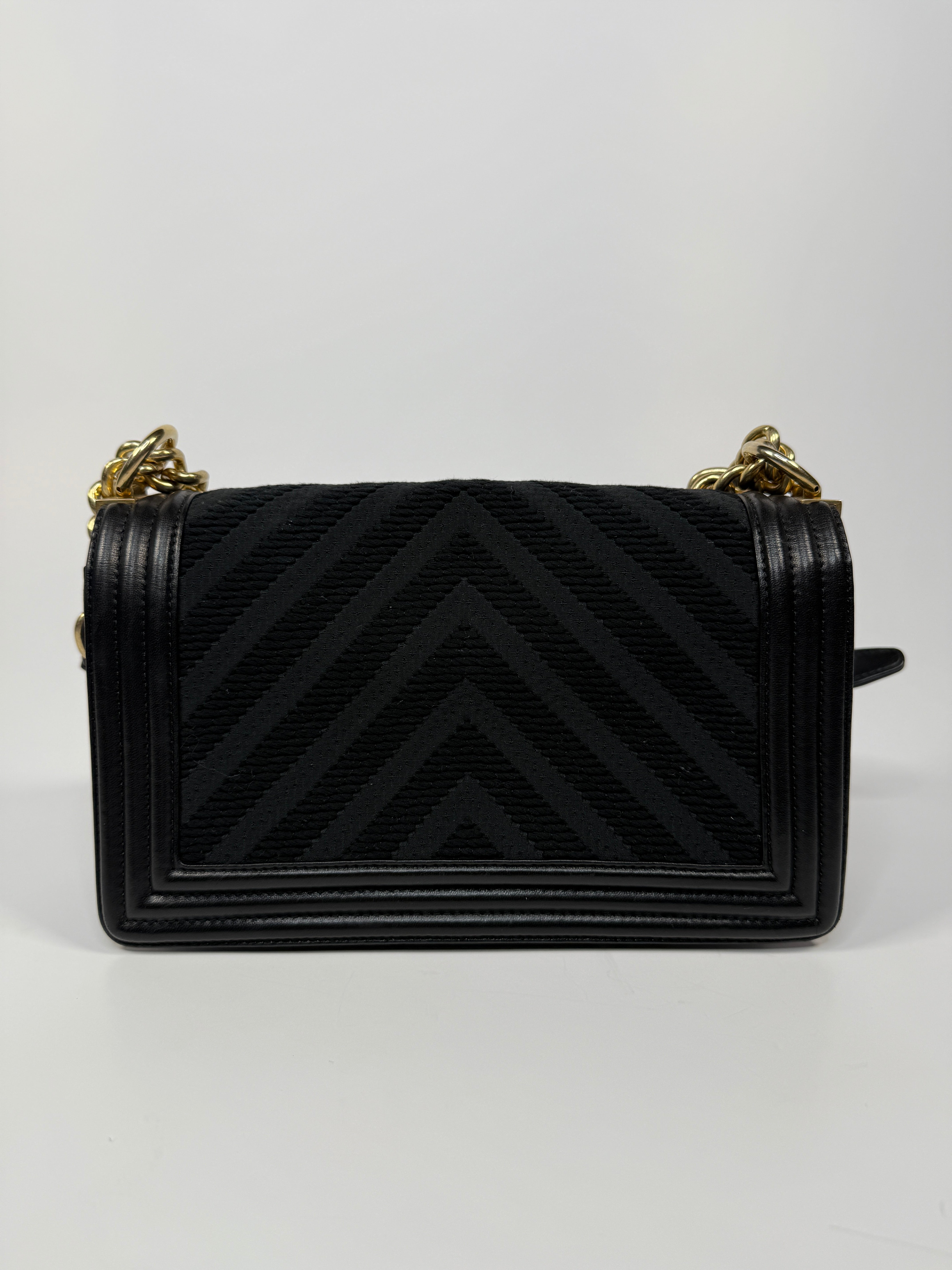 Chanel Black Chevron Fabric & Lambskin Leather Medium Boy Bag With Gold Hardware. Very Good Condition. Authentic and preloved. 