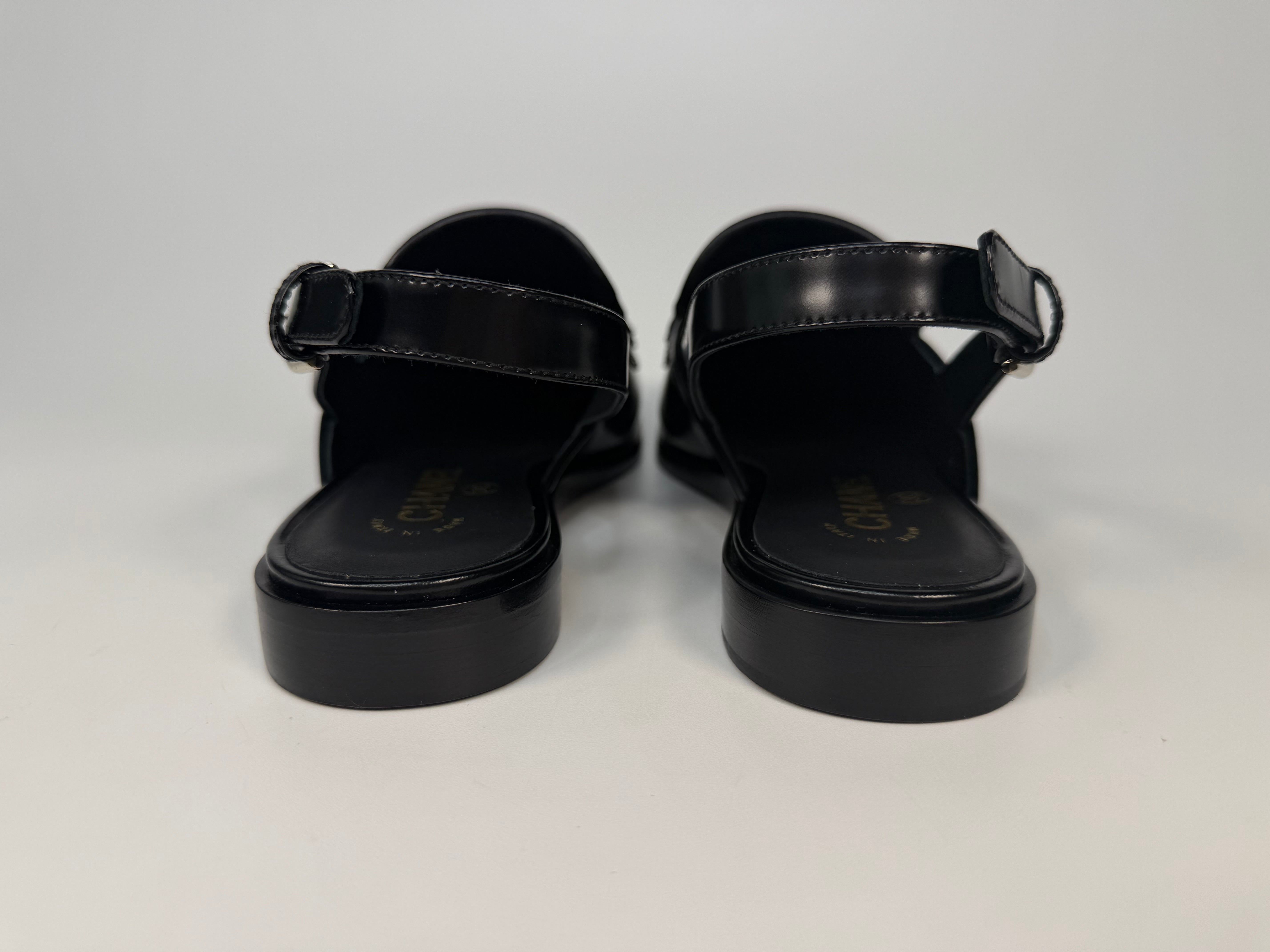 Chanel Spring/Summer Slingback In Black Shiny Calfskin (Size 38.5). Authentic and preloved in new/unused condition. verified by luxe cheshire. insured next day delivery