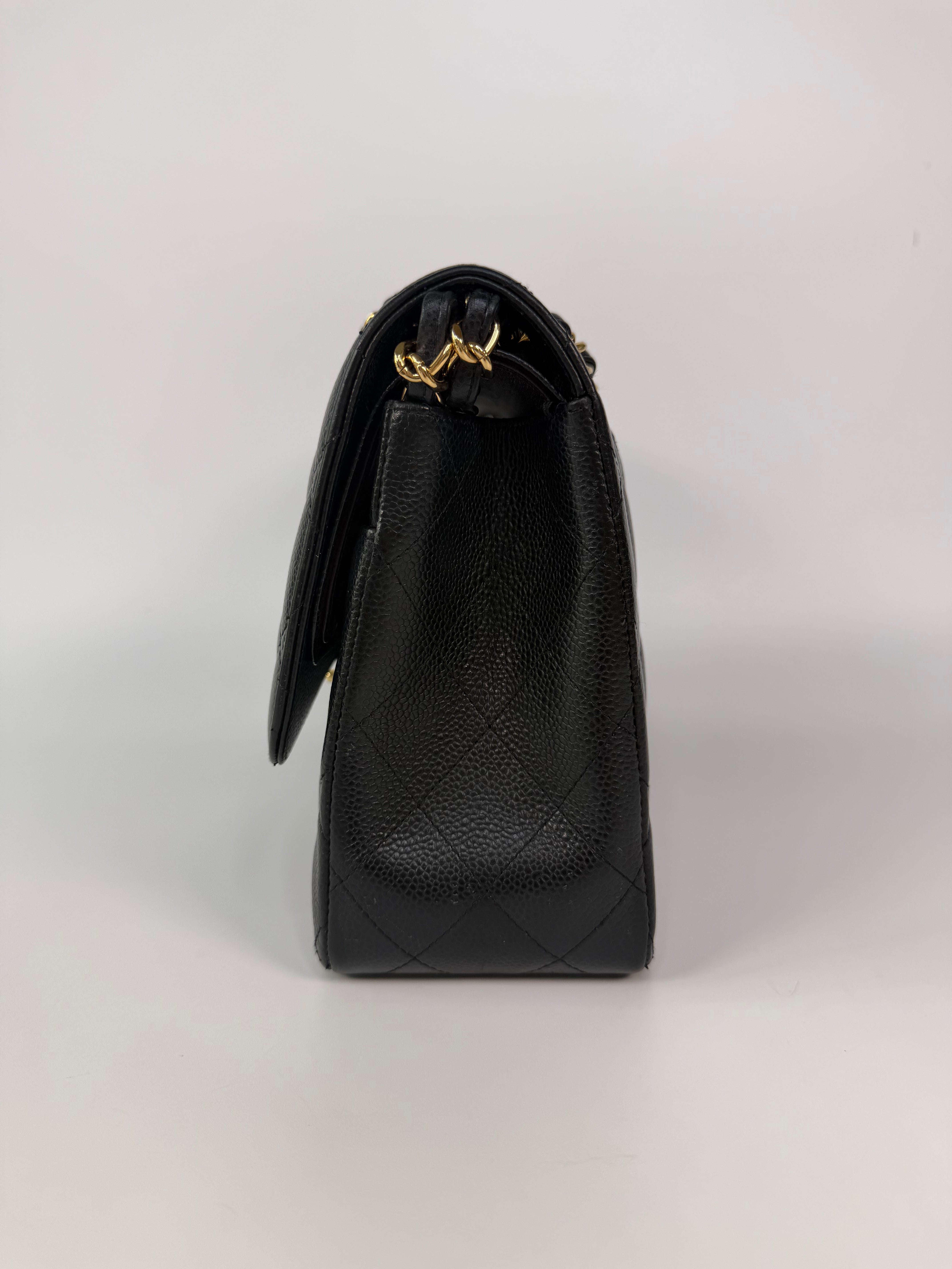 Chanel Jumbo Classic Flap Bag In Black Caviar Leather With Gold Hardware 100% authentic and preloved in excellent condition
