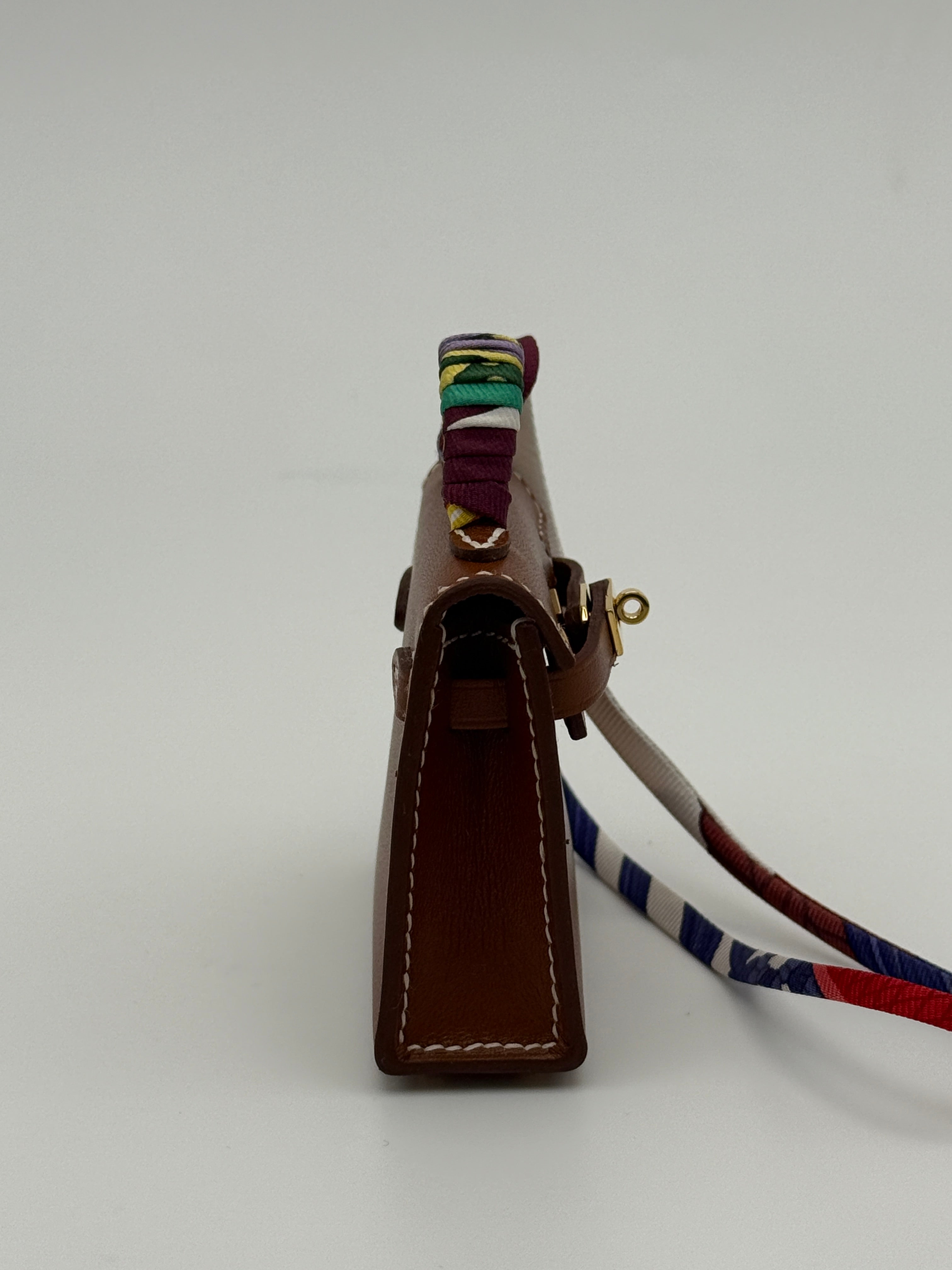 Hermès Kelly Twilly Charm In Gold Tadelakt Leather With GHW