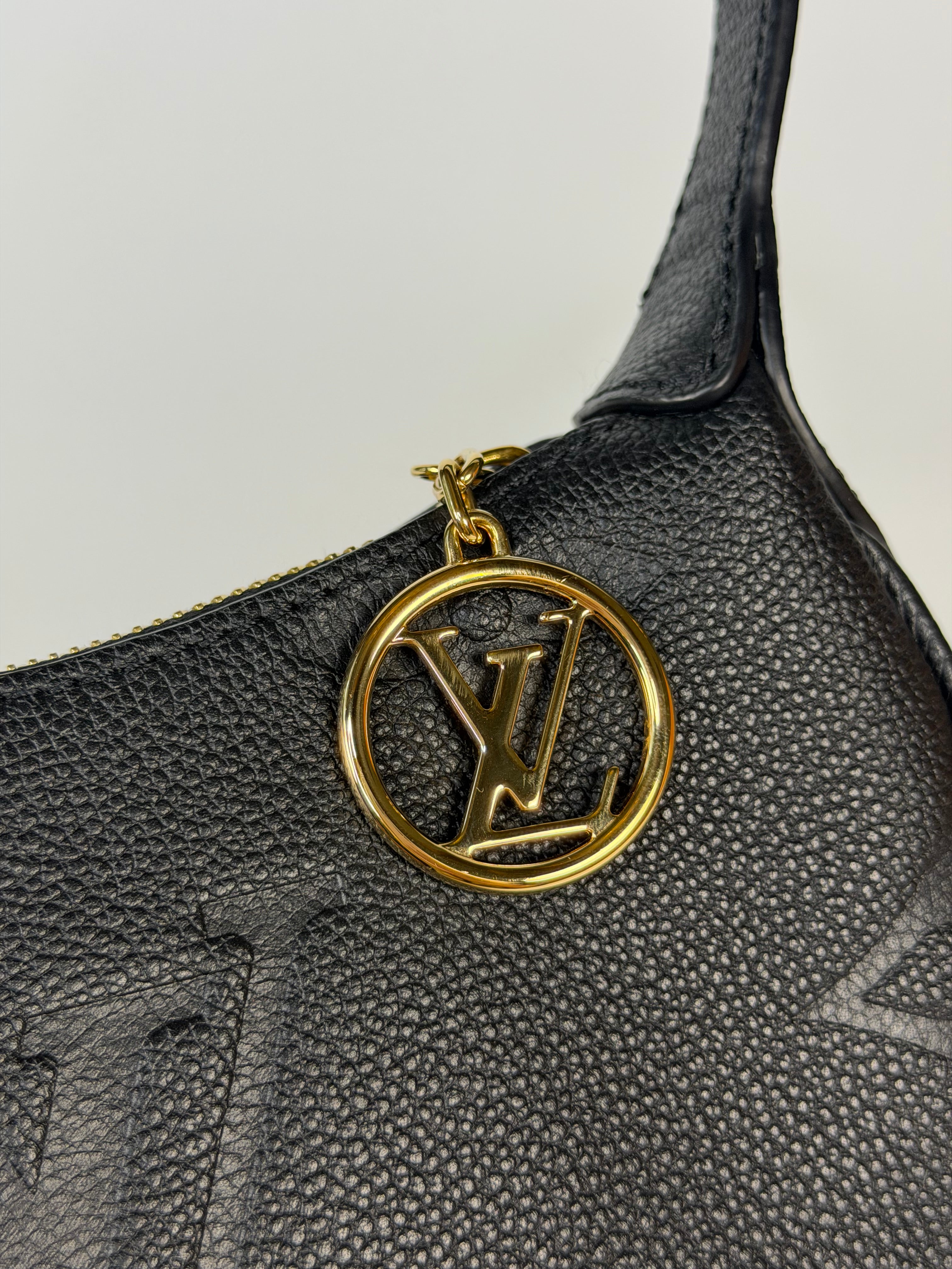 Louis Vuitton Mini Moon Bag In Black Leather With Gold Hardware in excellent condition 100% authentic and preloved