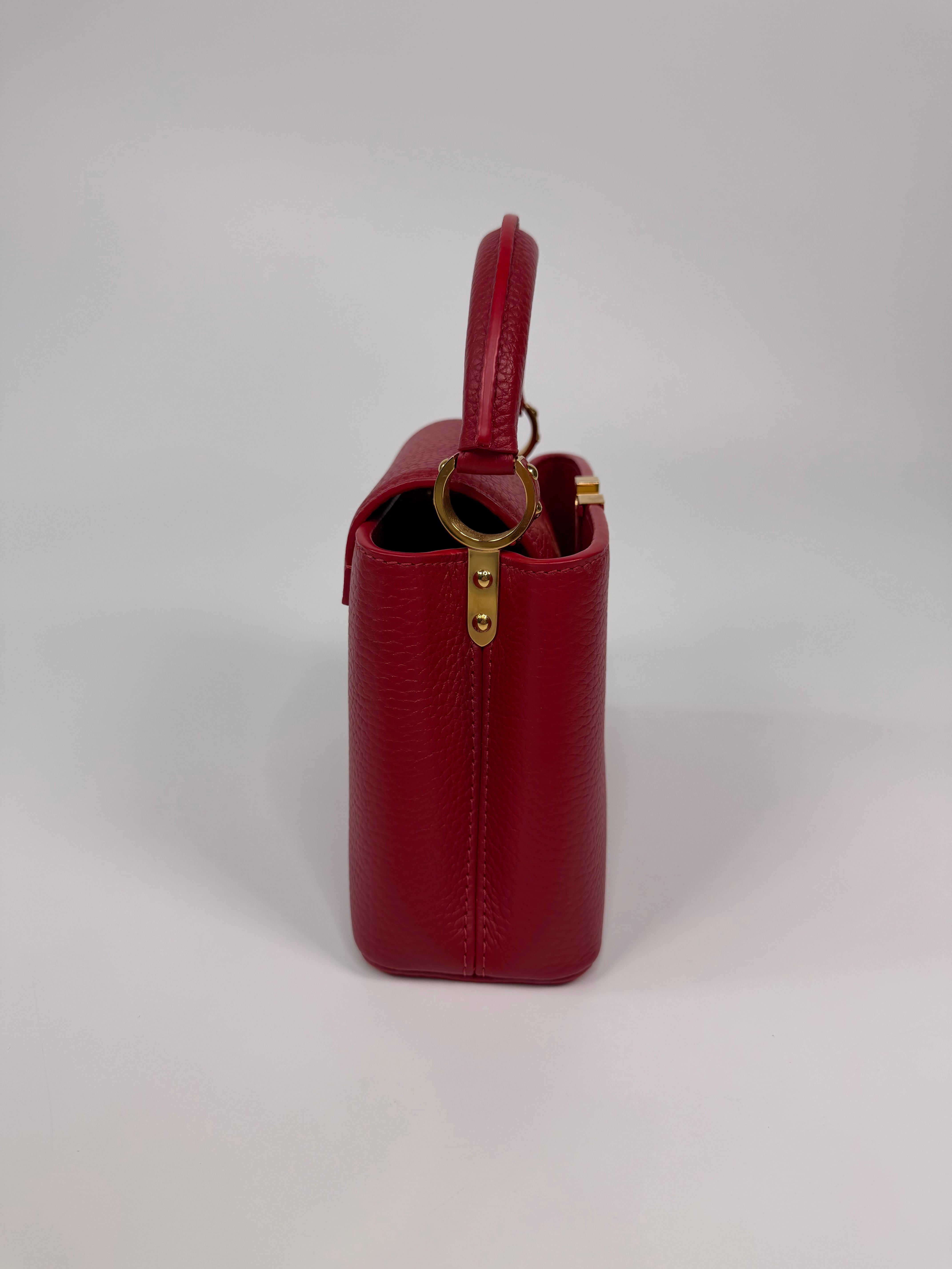 Louis Vuitton Capucines BB Bag In Scarlet Taurillion Leather With Gold Hardware. Authentic and preloved in excellent condition