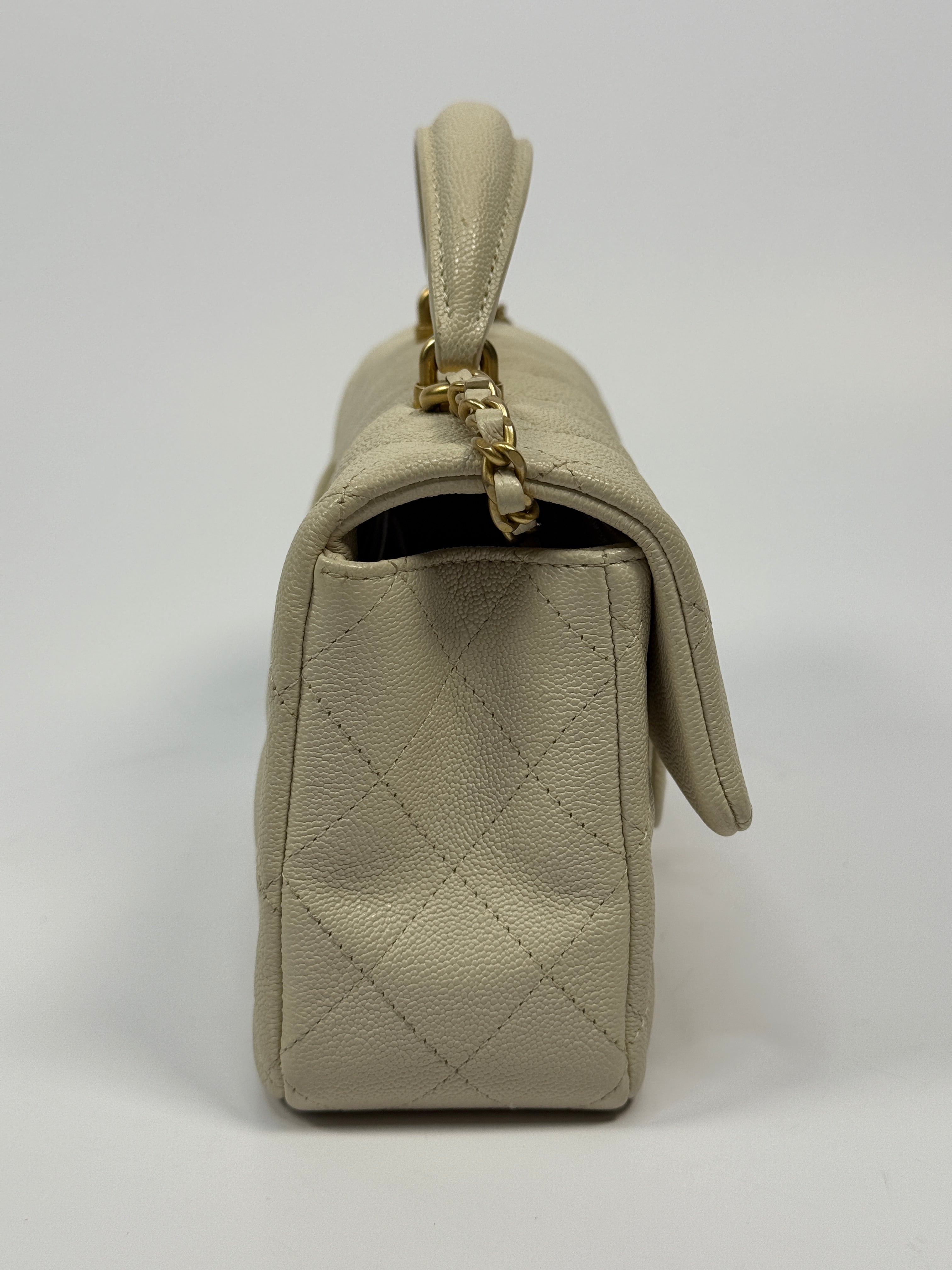 Chanel Mini Rectangle Top Handle In Ecru Caviar With Gold hardware, authentic and preloved in excellent condition