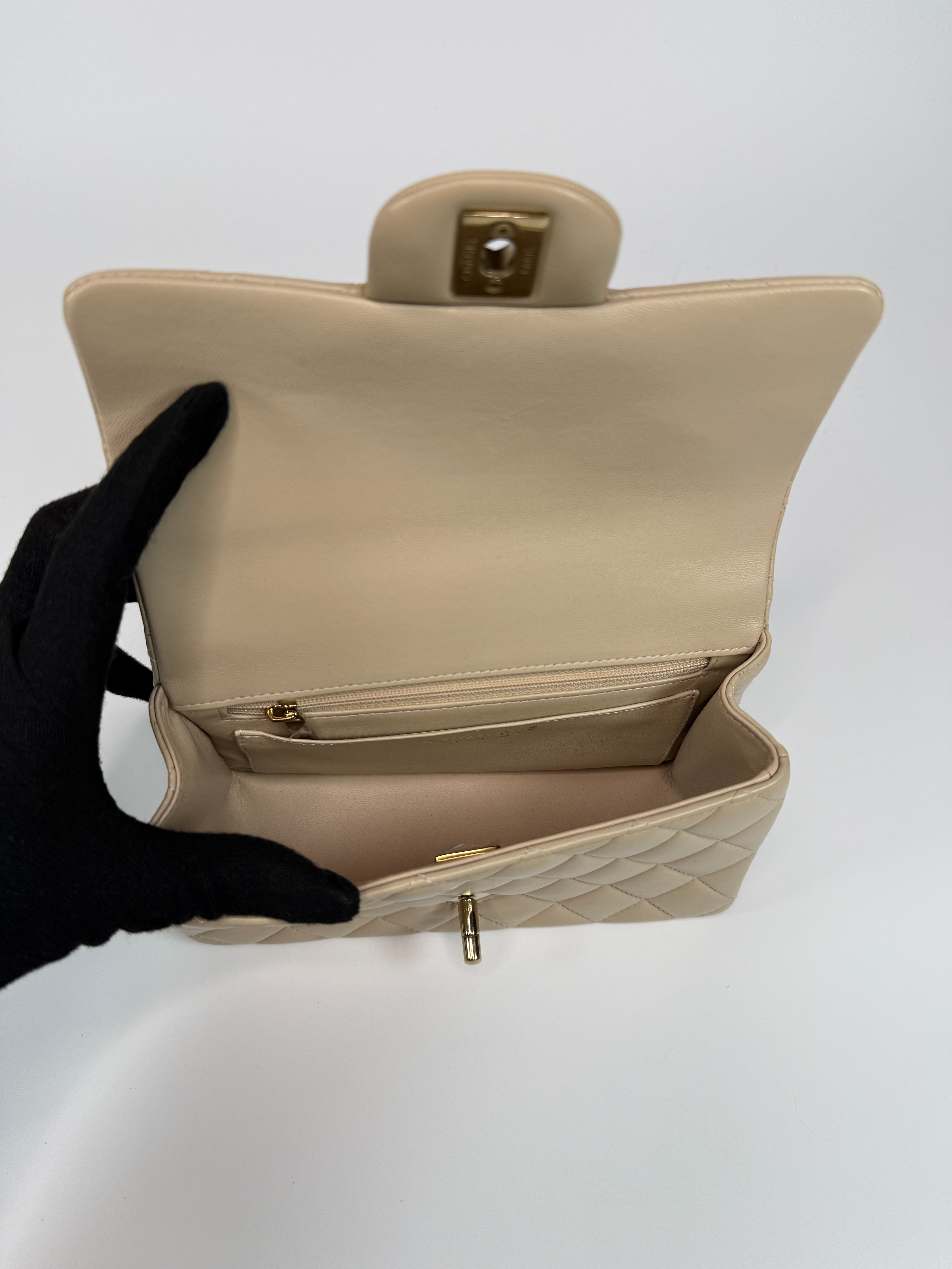 Authentic and preloved Chanel Mini Rectangle Top Handle In Ecru Lambskin With Gold Hardware in excellent condition, Fully insured next day delivery. Verified by Luxe Cheshire. 100% Authenticity guarantee,