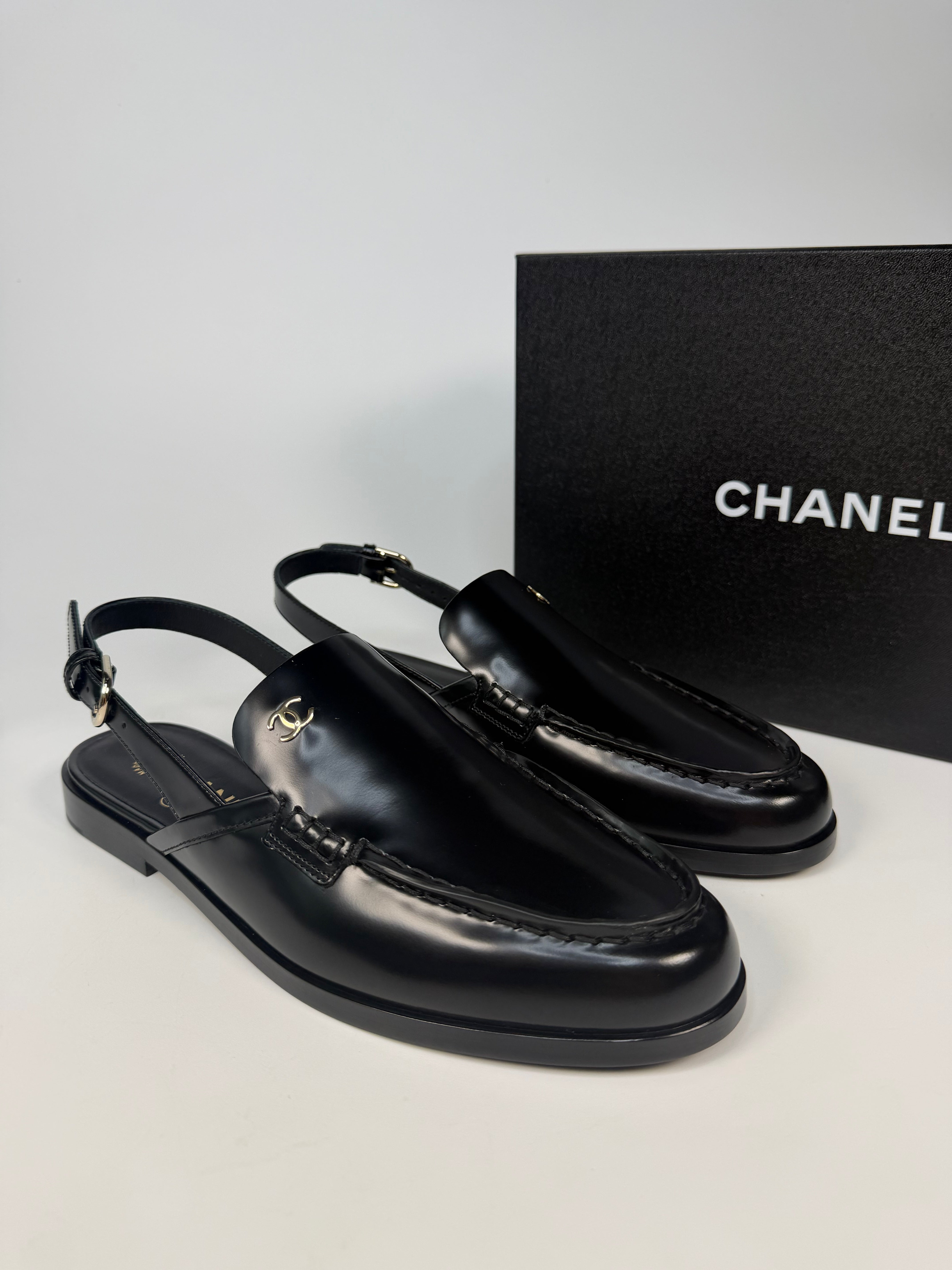 Chanel Spring/Summer Slingback In Black Shiny Calfskin (Size 38.5). Authentic and preloved in new/unused condition. verified by luxe cheshire. insured next day delivery