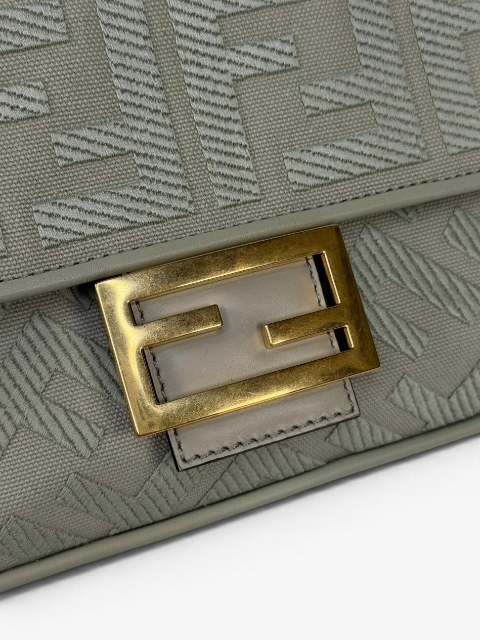 Fendi Baguette In Green Tea FF Monogram Fabric and Canvas With Gold Hardware. 100% authentic and preloved in excellent condition